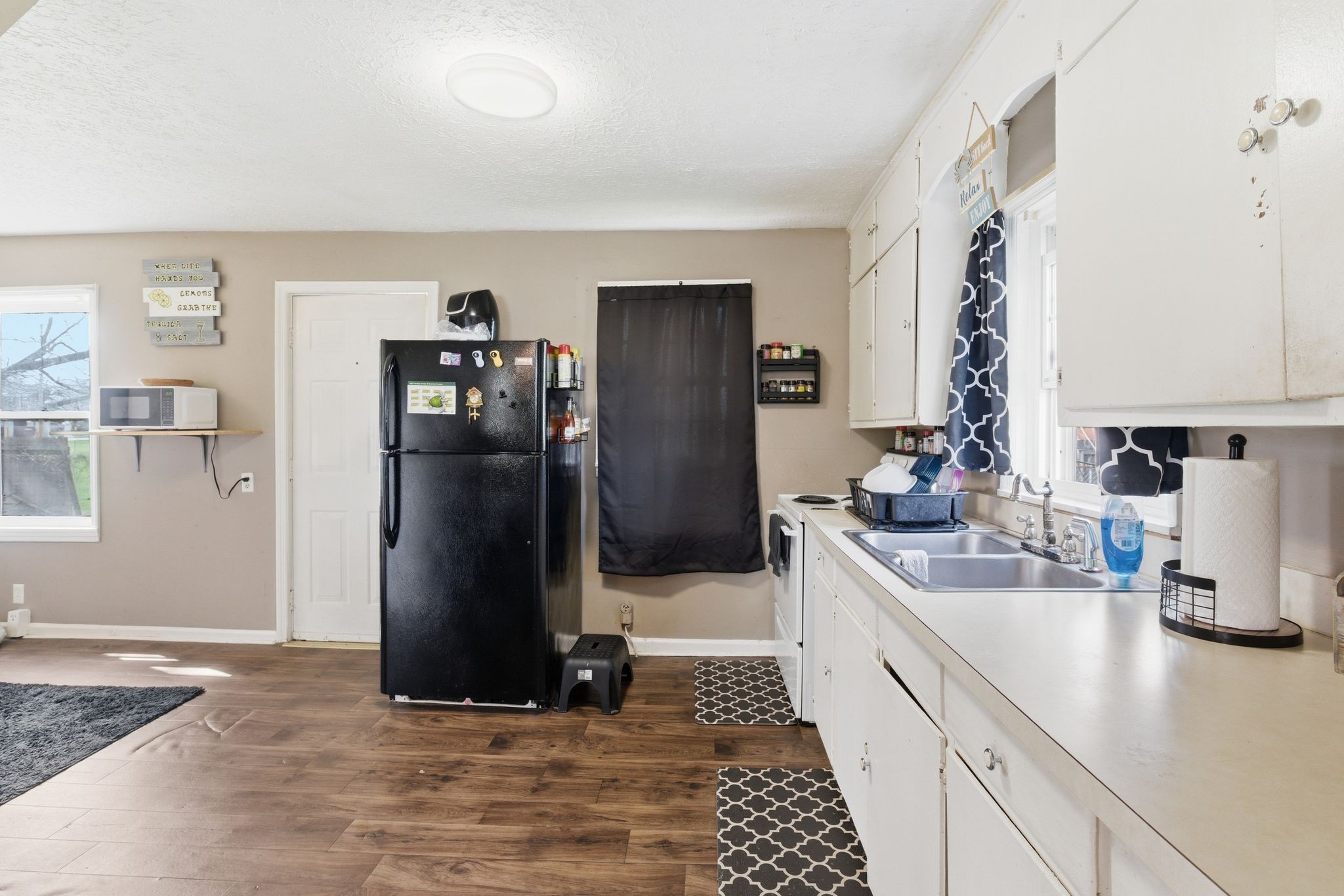 703 McCurdy Road White House, TN 37188 - Photo 12 of 26 a kitchen with a refrigerator and a sink