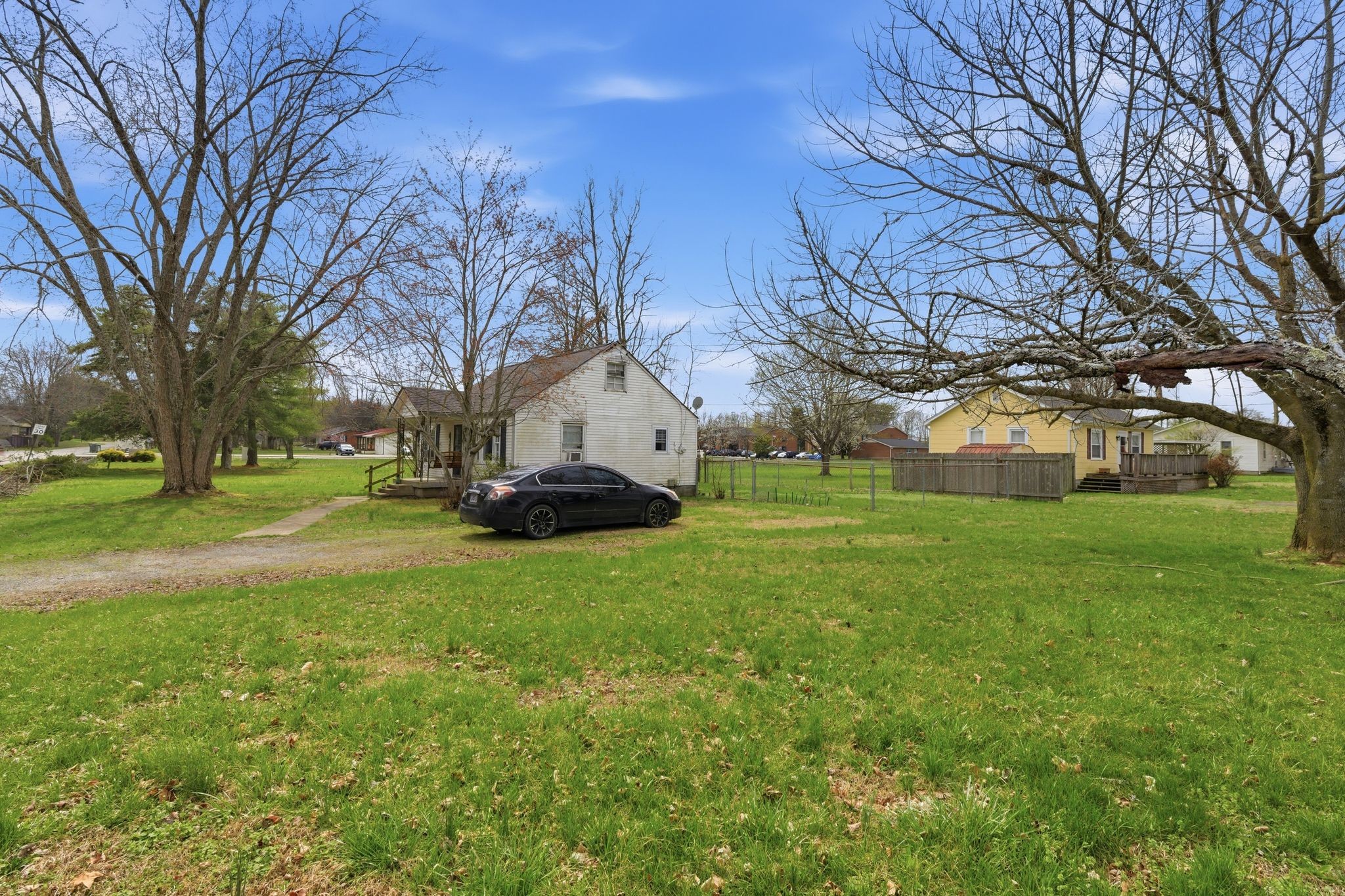 703 McCurdy Road White House, TN 37188 - Photo 4 of 26 a view of a house with backyard and tree