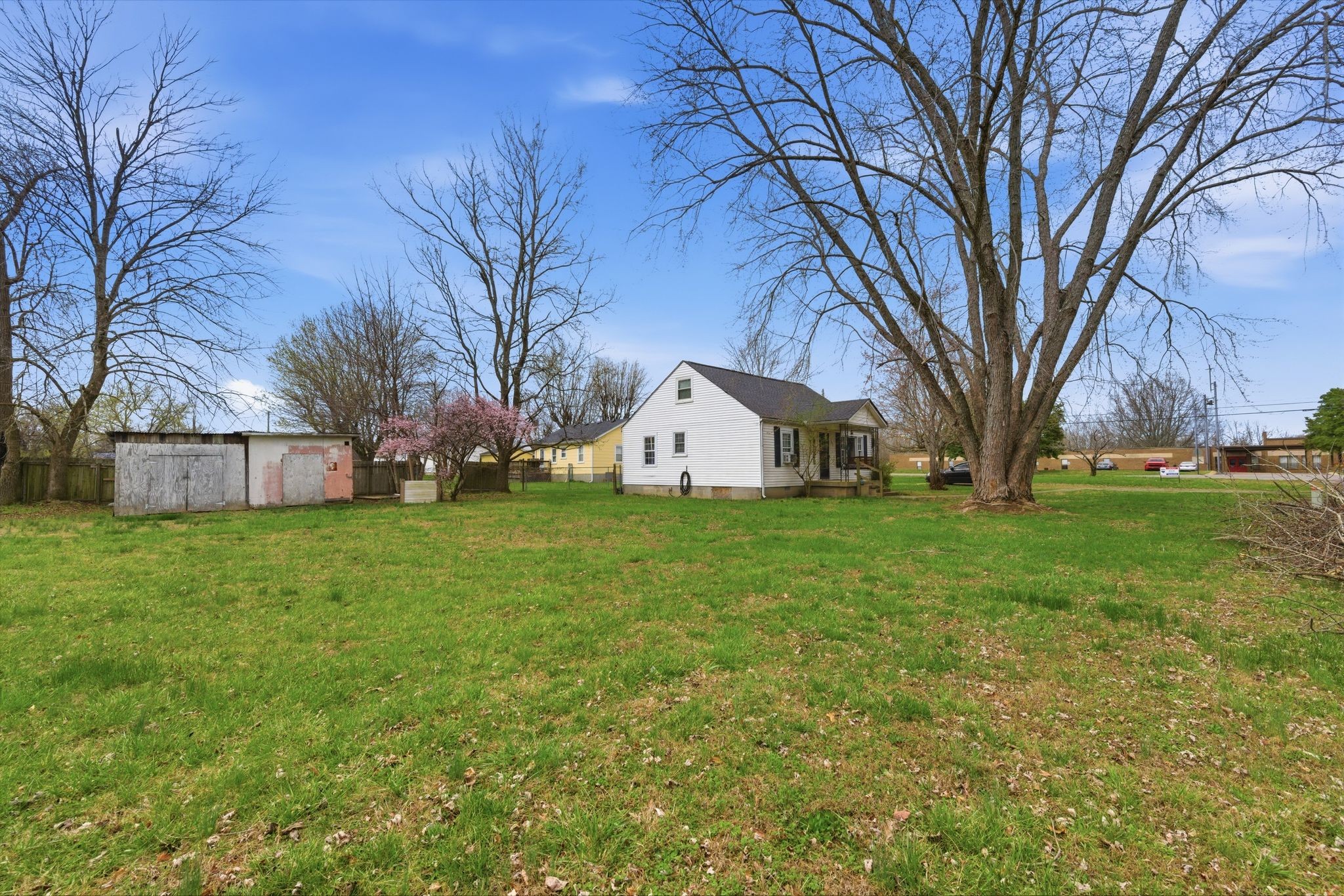 703 McCurdy Road White House, TN 37188 - Photo 6 of 26 a view of a white house in front of a big yard with large trees