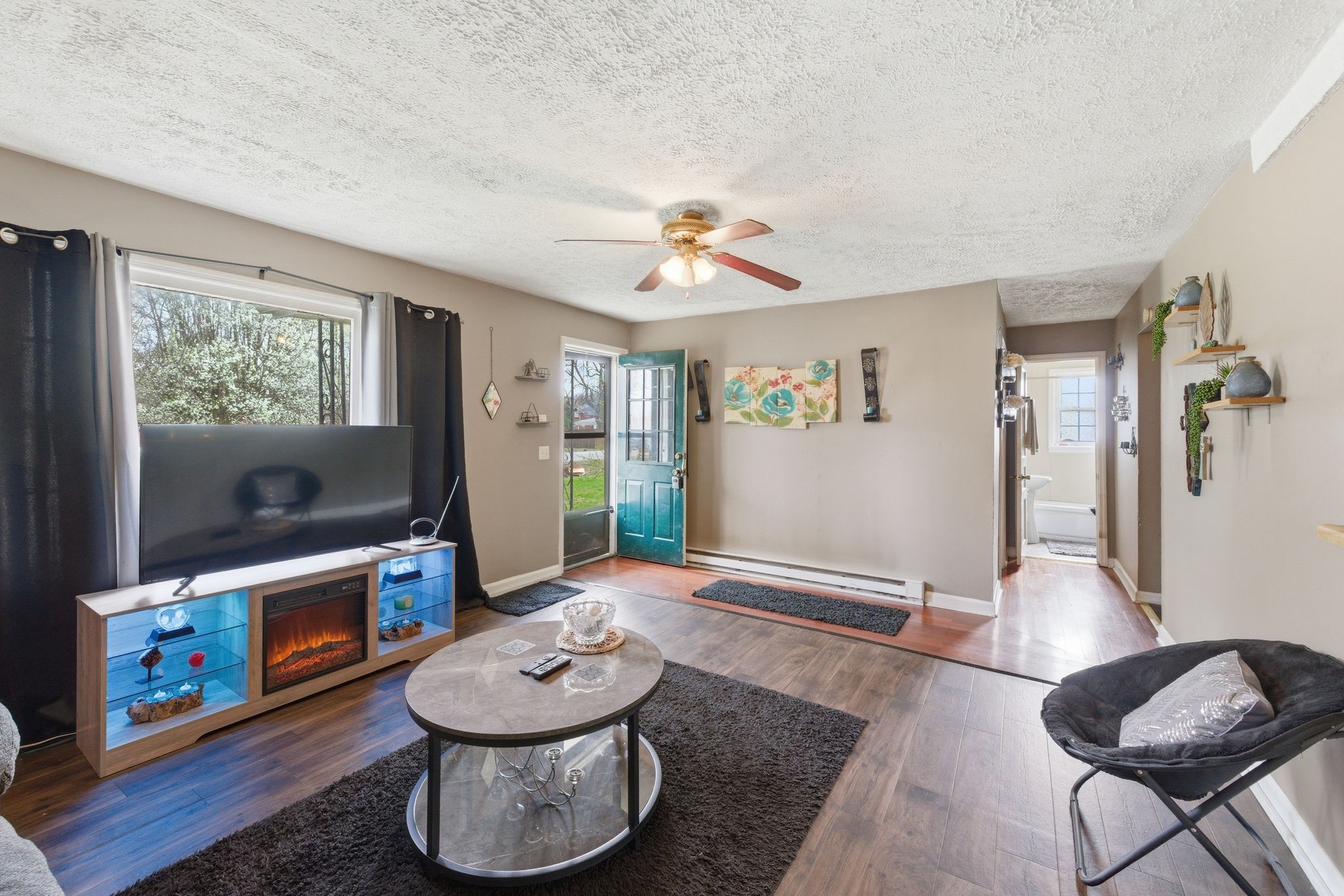 703 McCurdy Road White House, TN 37188 - Photo 10 of 26 a living room with furniture and a flat screen tv