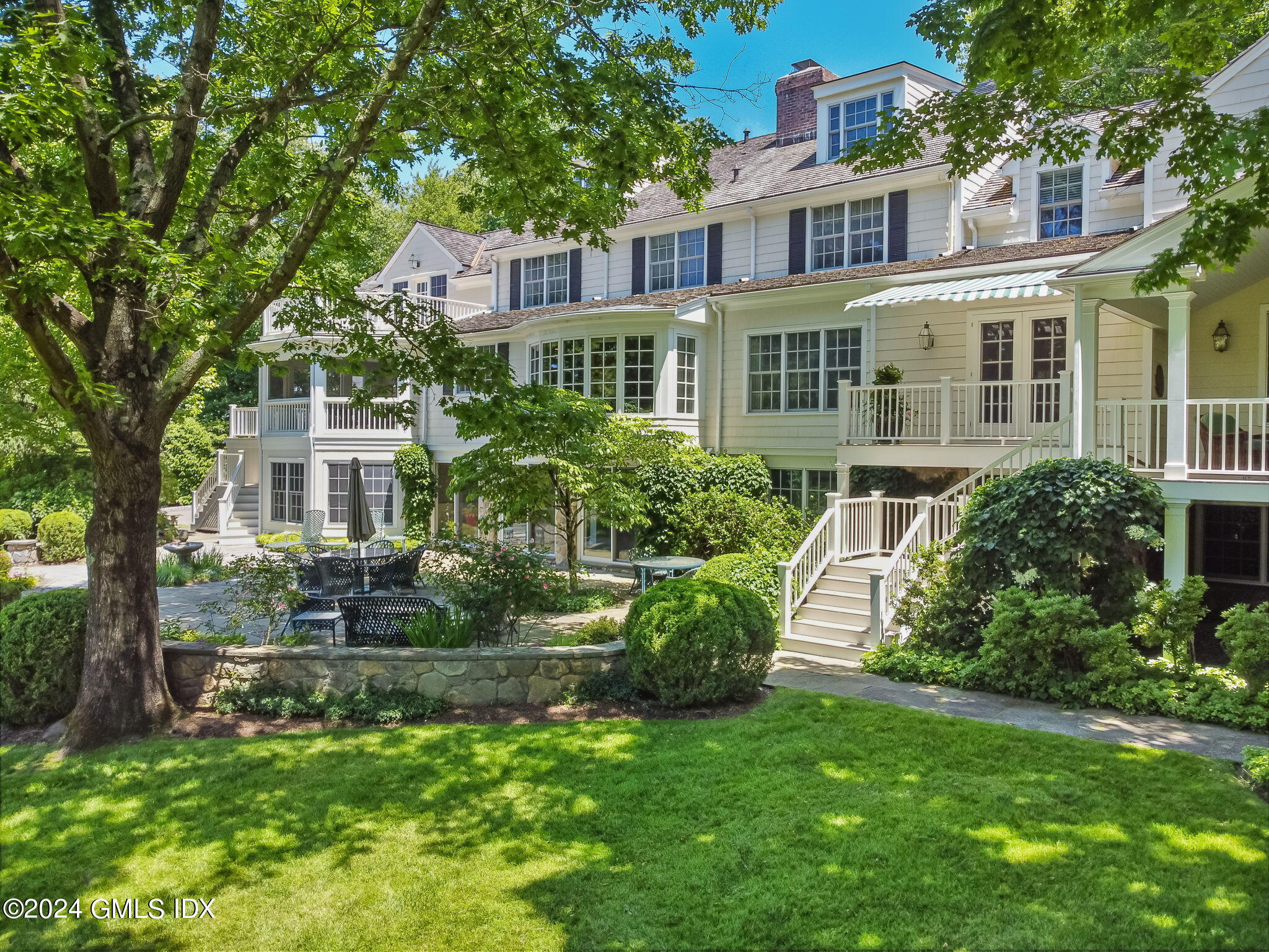 21 Dempsey Lane Greenwich, CT 06830 - Photo 1 of 32 front view of a house with a yard