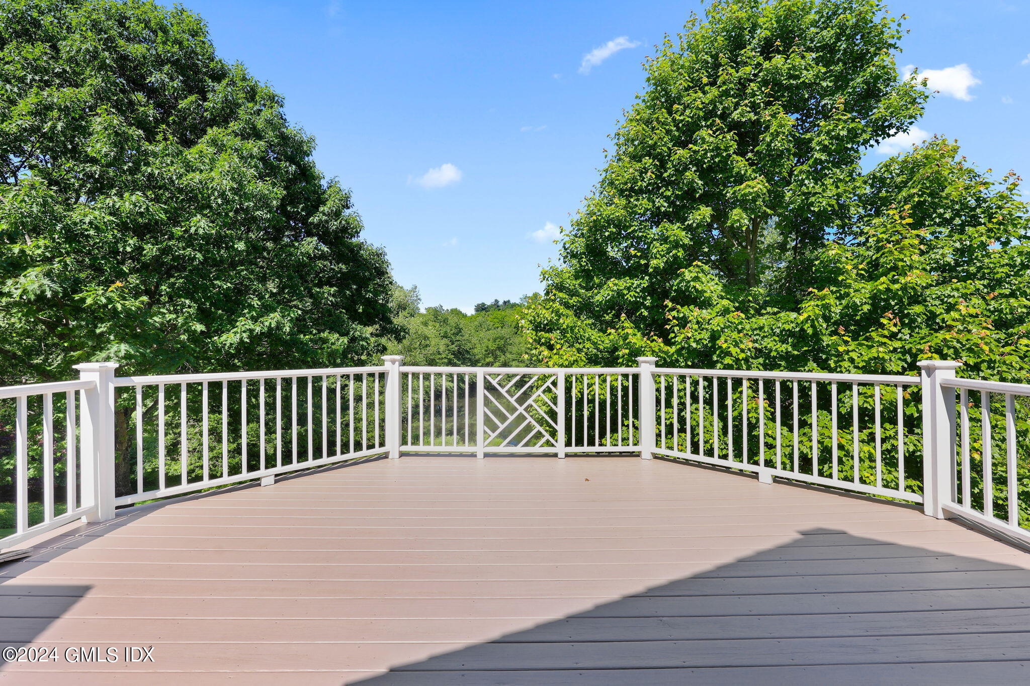 21 Dempsey Lane Greenwich, CT 06830 - Photo 14 of 32 a balcony with wooden floor and fence