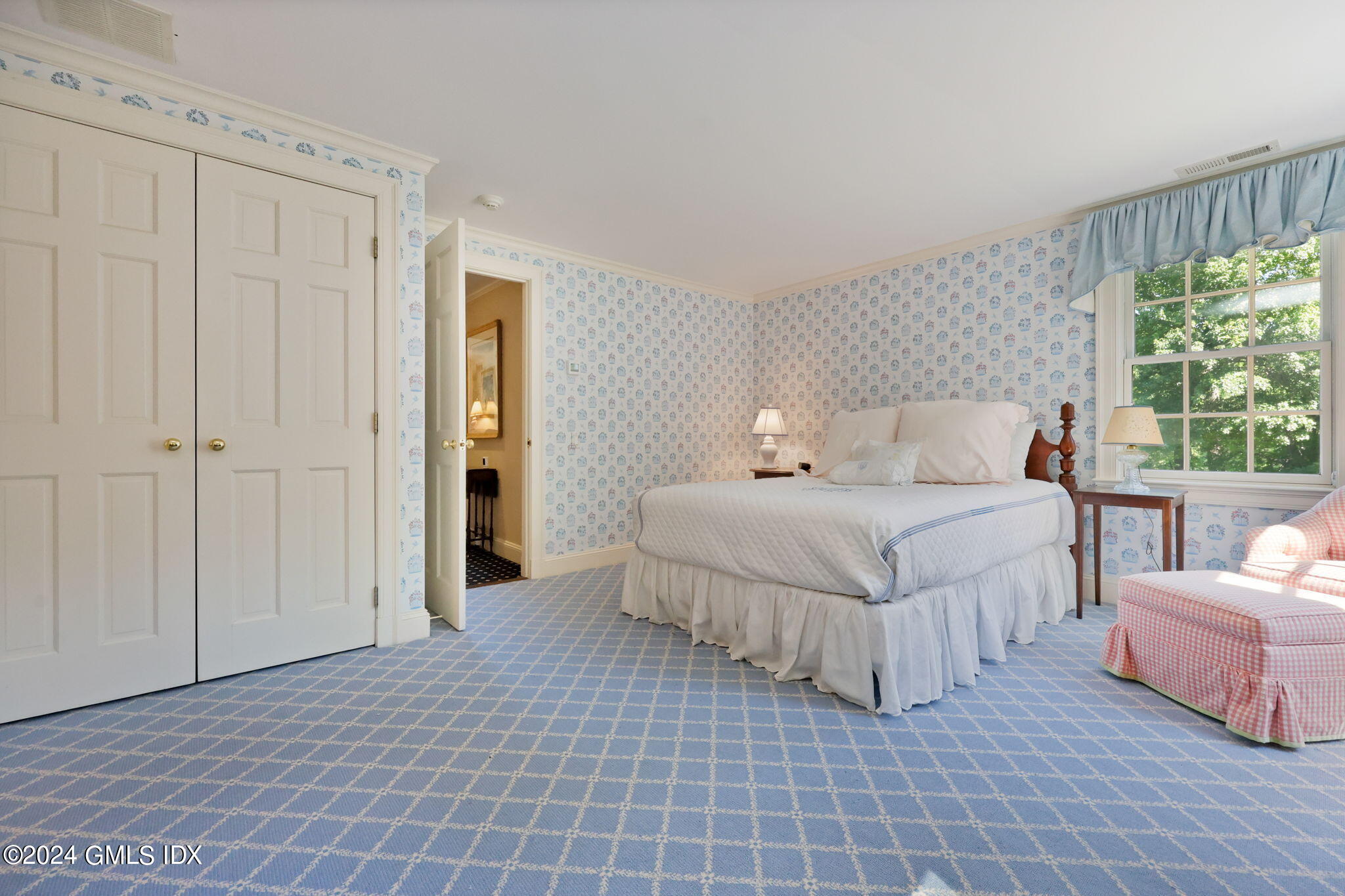 21 Dempsey Lane Greenwich, CT 06830 - Photo 16 of 32 a bedroom with a bed and a large window