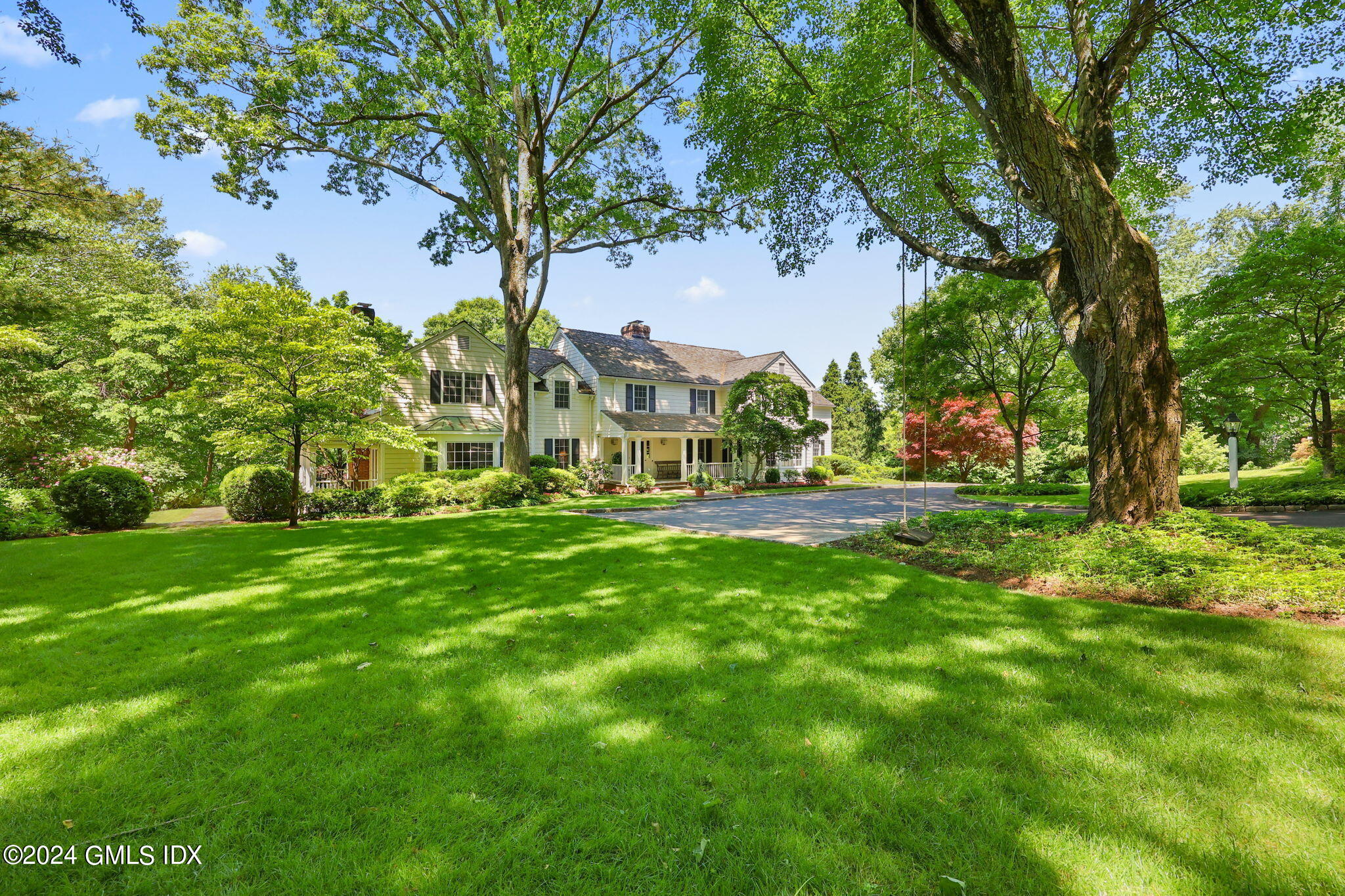 21 Dempsey Lane Greenwich, CT 06830 - Photo 2 of 32 a view of an house with backyard space and garden