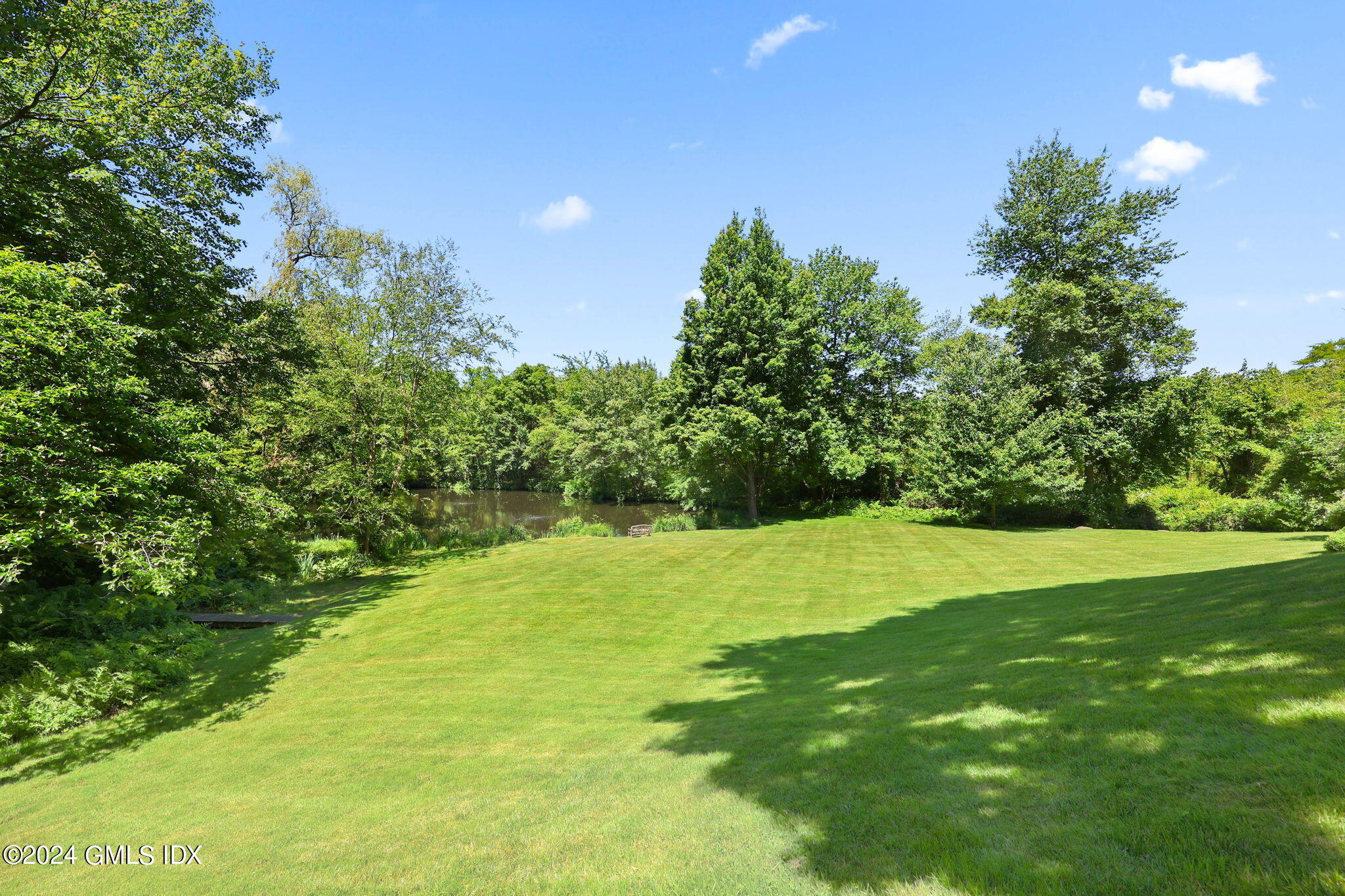 21 Dempsey Lane Greenwich, CT 06830 - Photo 27 of 32 a view of field with tall trees