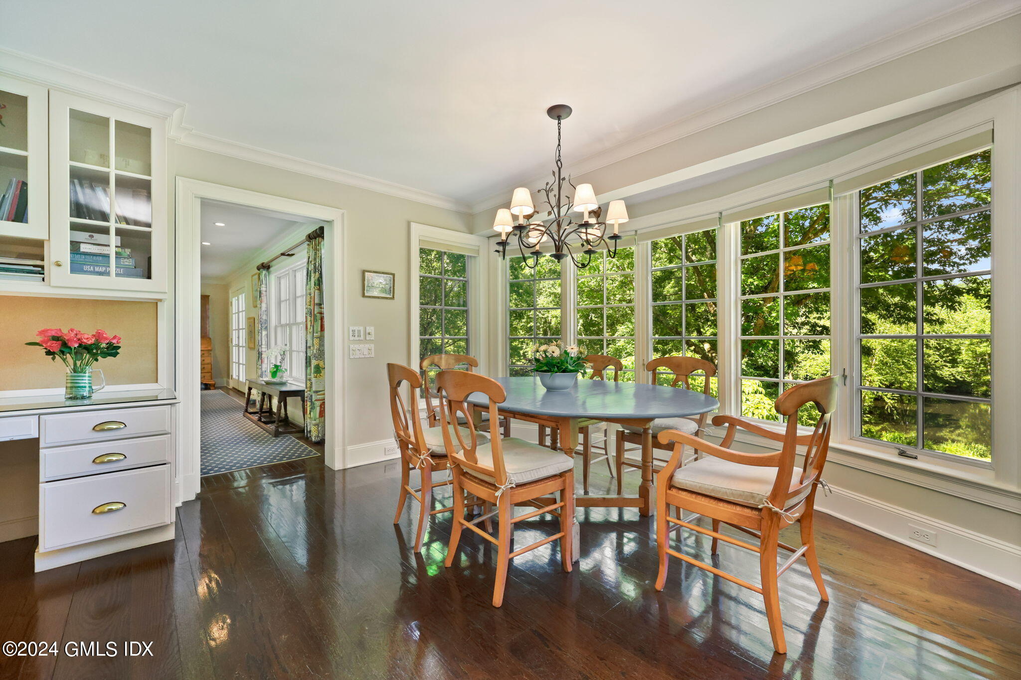 21 Dempsey Lane Greenwich, CT 06830 - Photo 7 of 32 a view of a dining room with furniture a chandelier and wooden floor