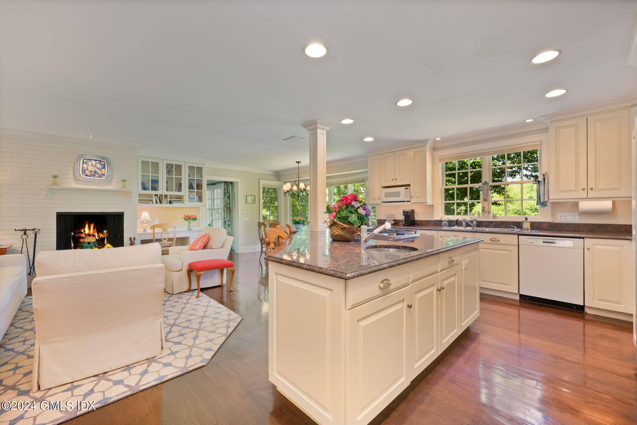 21 Dempsey Lane Greenwich, CT 06830 - Photo 8 of 32 a kitchen with stainless steel appliances granite countertop a sink cabinets and wooden floor