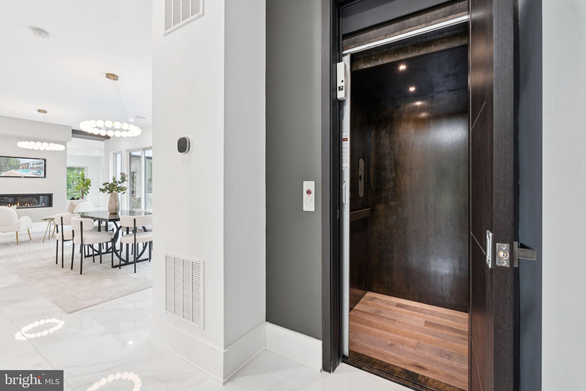 2209 Hunter Mill Road Vienna, VA 22181 - Photo 16 of 63 a view of a hallway with dining area and glass door