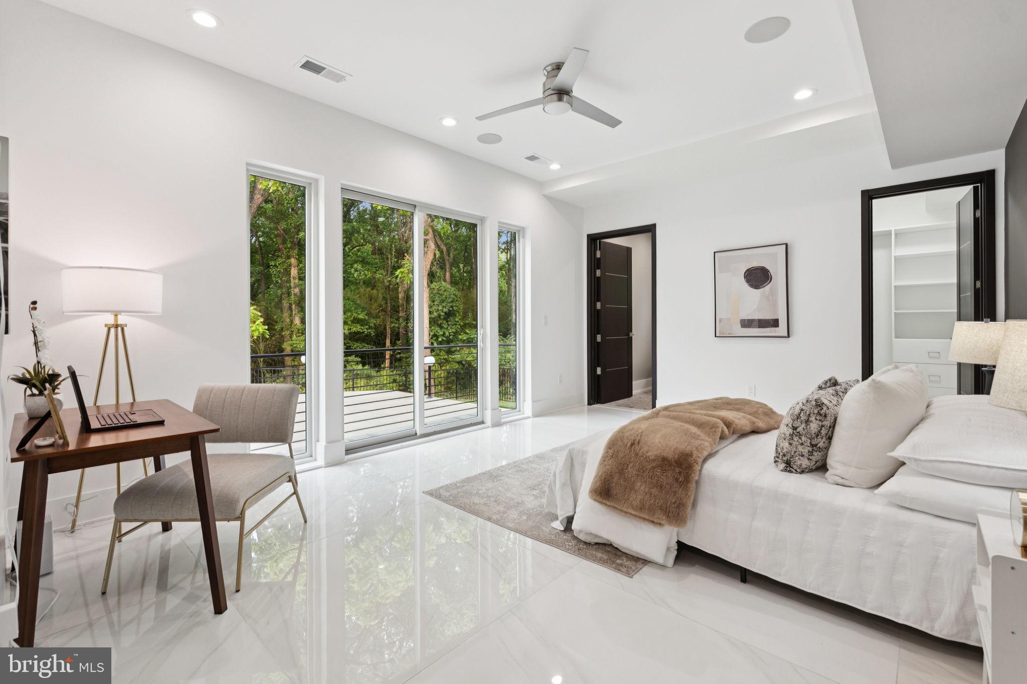 2209 Hunter Mill Road Vienna, VA 22181 - Photo 17 of 63 a living room with furniture and large windows