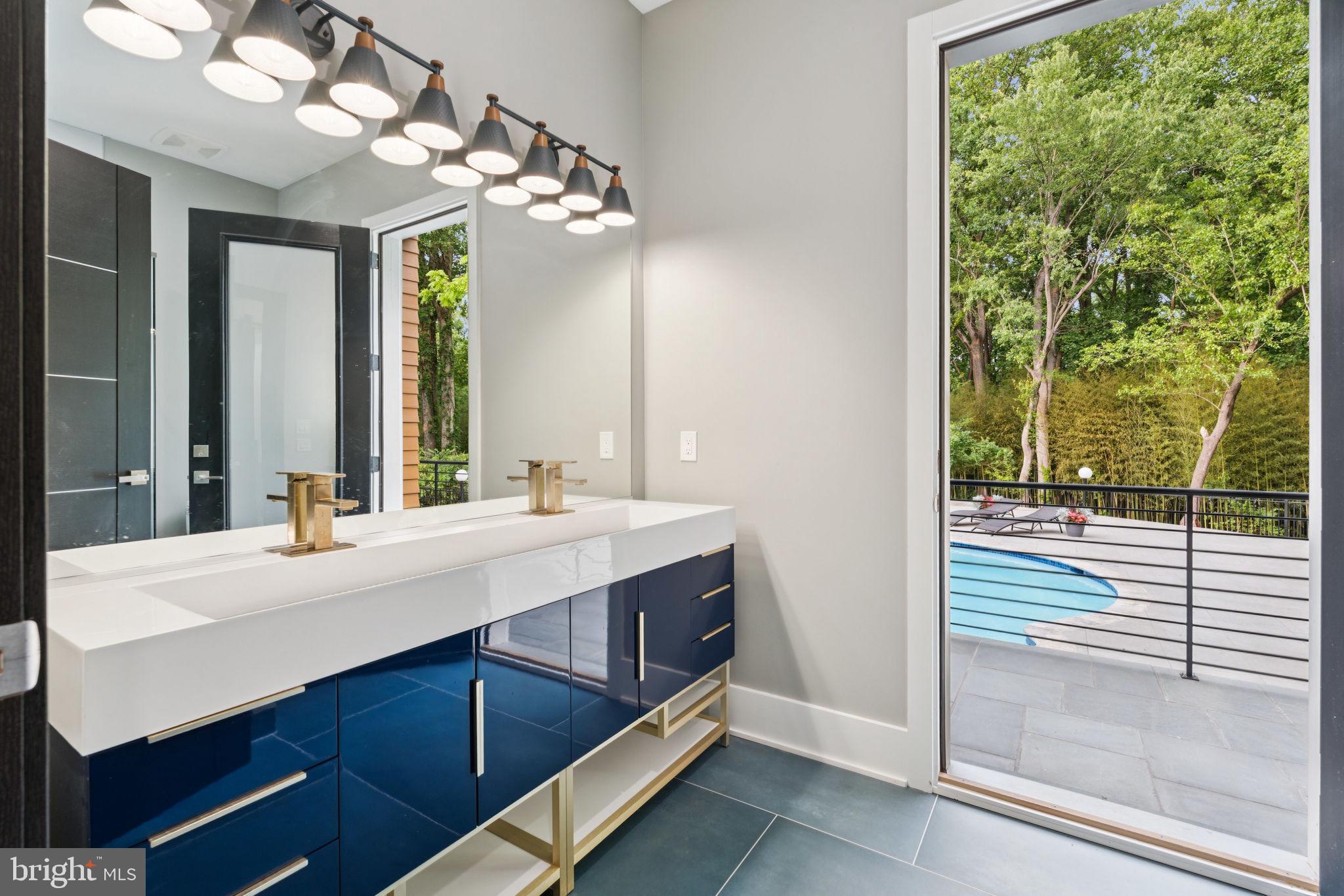 2209 Hunter Mill Road Vienna, VA 22181 - Photo 18 of 63 a bathroom with a double vanity sink and a mirror