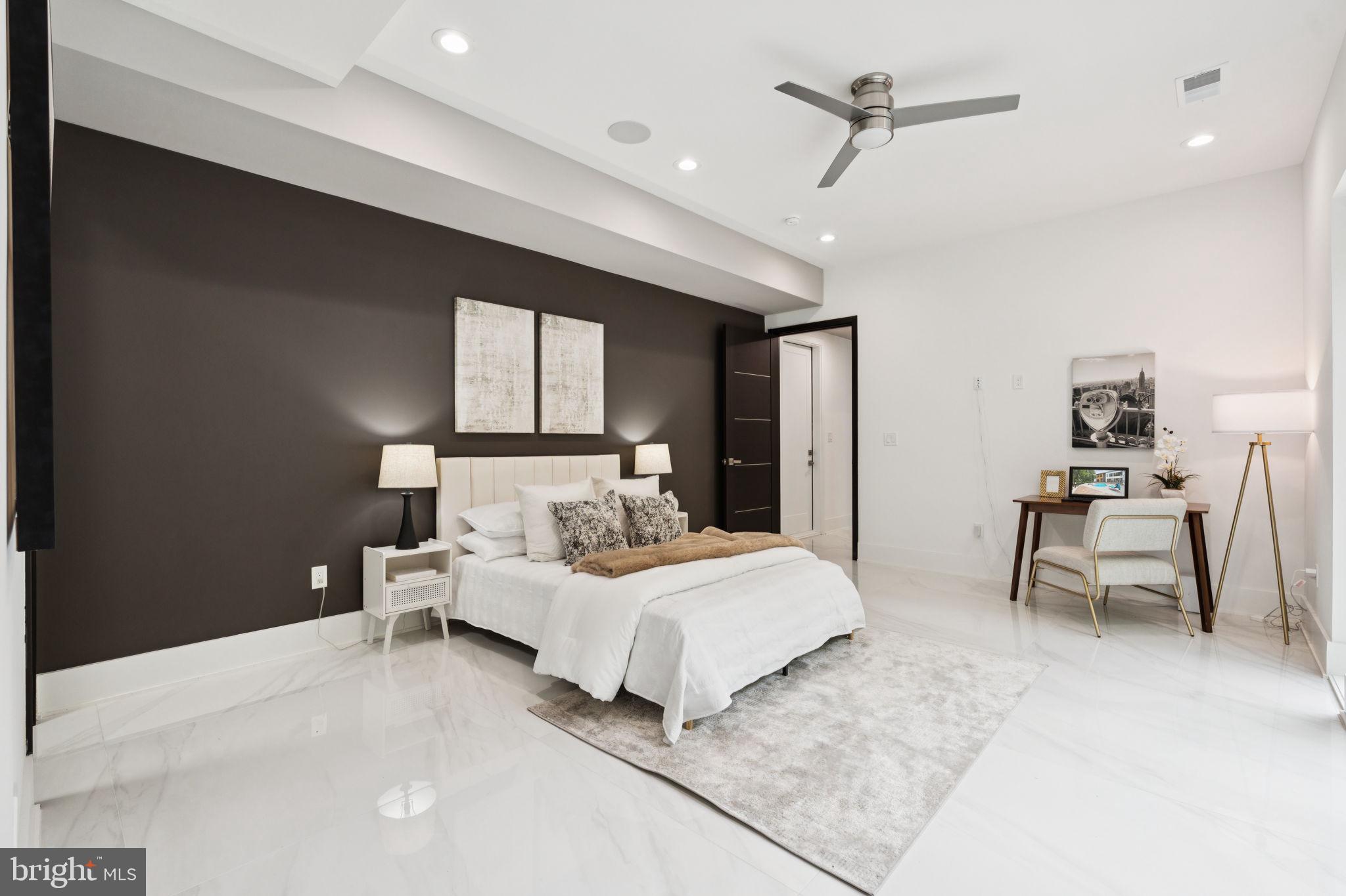 2209 Hunter Mill Road Vienna, VA 22181 - Photo 19 of 63 a bedroom with a bed and a chair