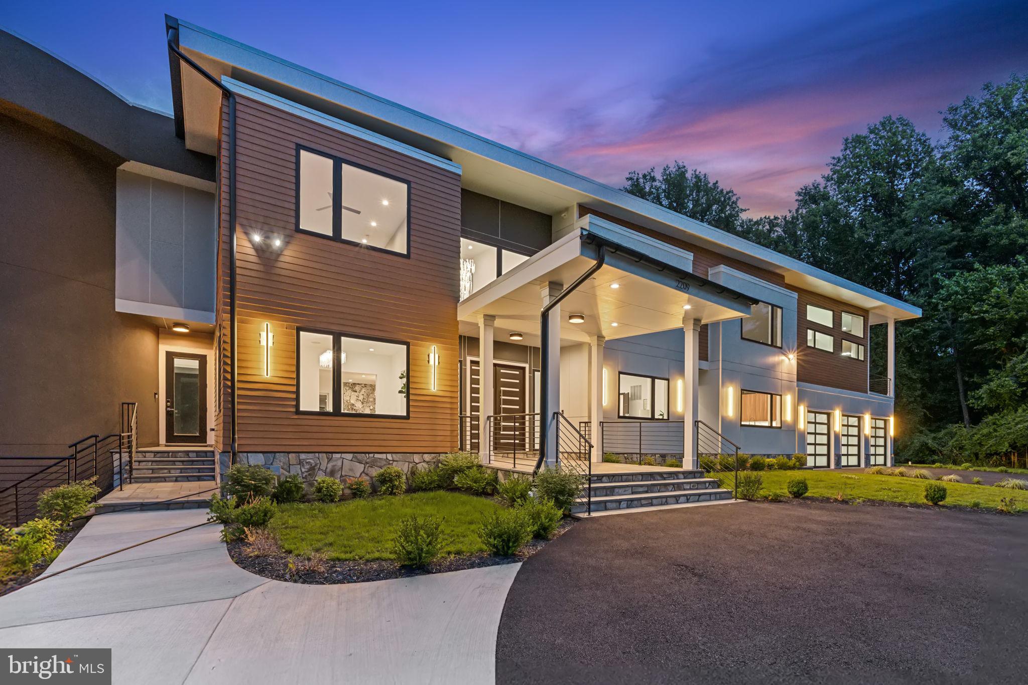 2209 Hunter Mill Road Vienna, VA 22181 - Photo 2 of 63 a front view of a house with a yard