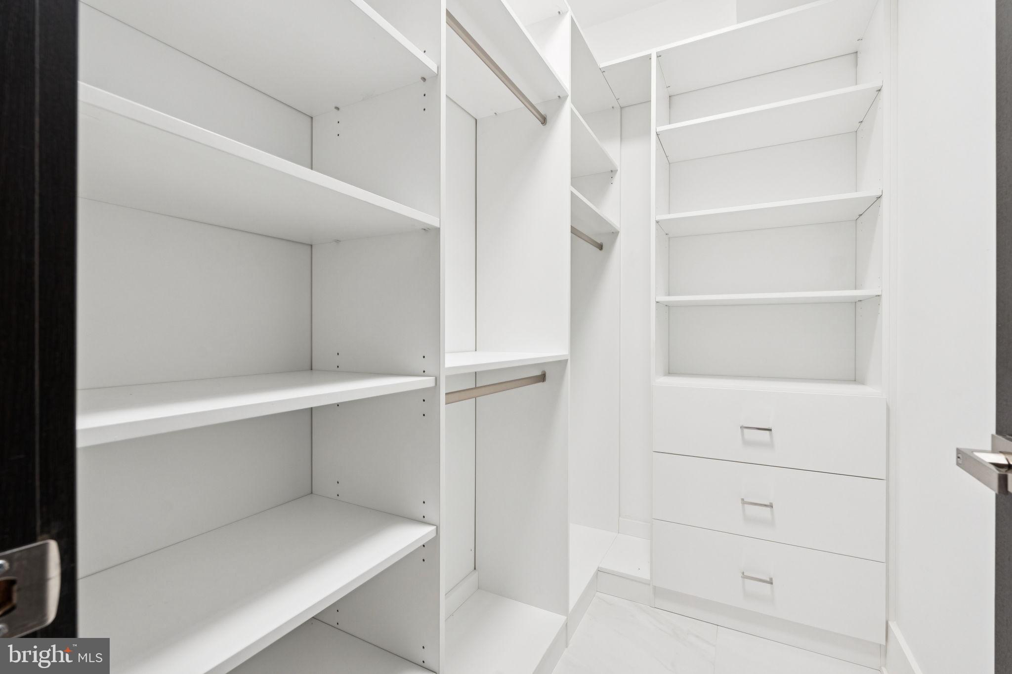 2209 Hunter Mill Road Vienna, VA 22181 - Photo 21 of 63 a view of an empty walk in closet