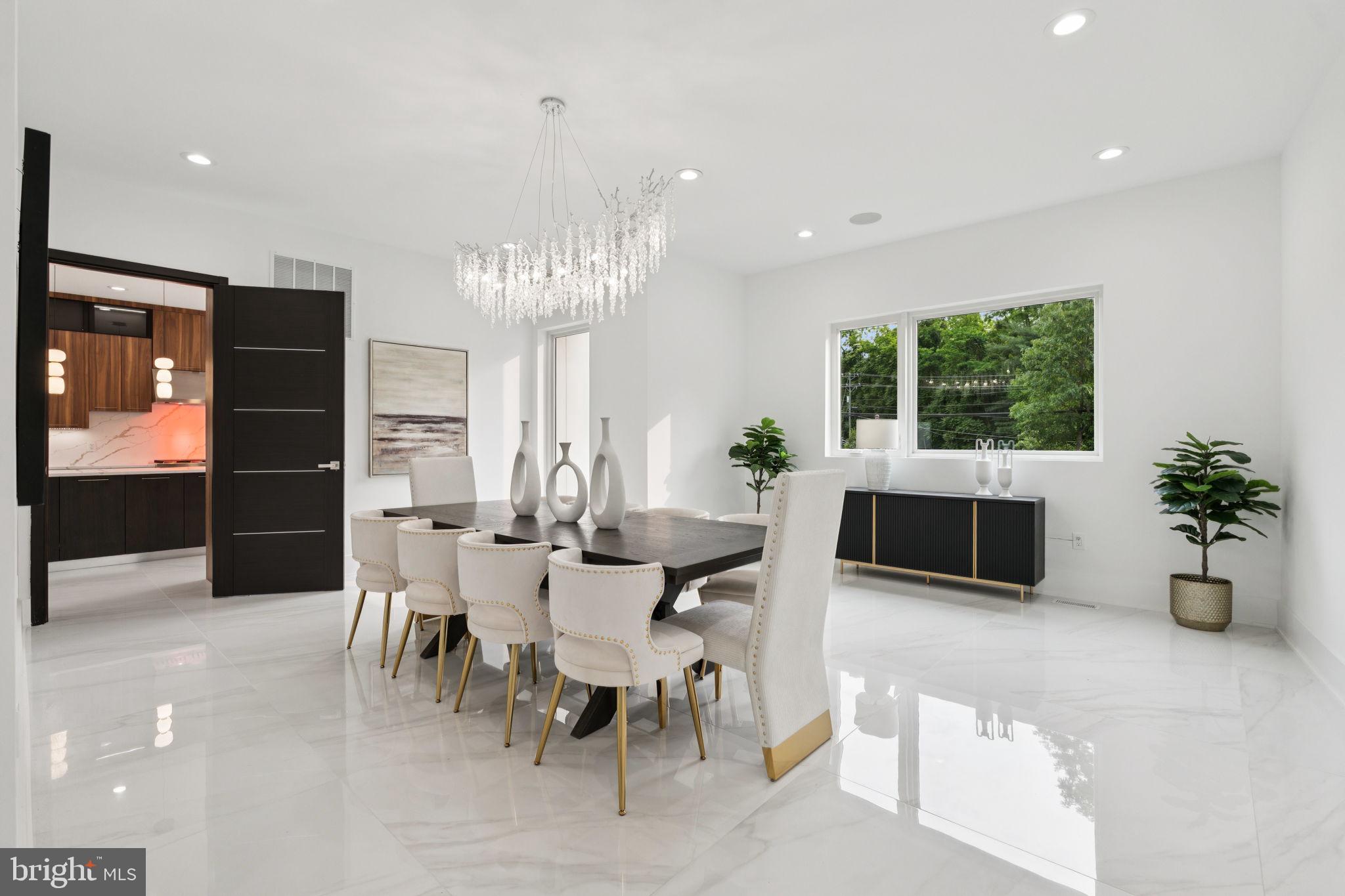 2209 Hunter Mill Road Vienna, VA 22181 - Photo 22 of 63 a living room with furniture a window and a potted plant