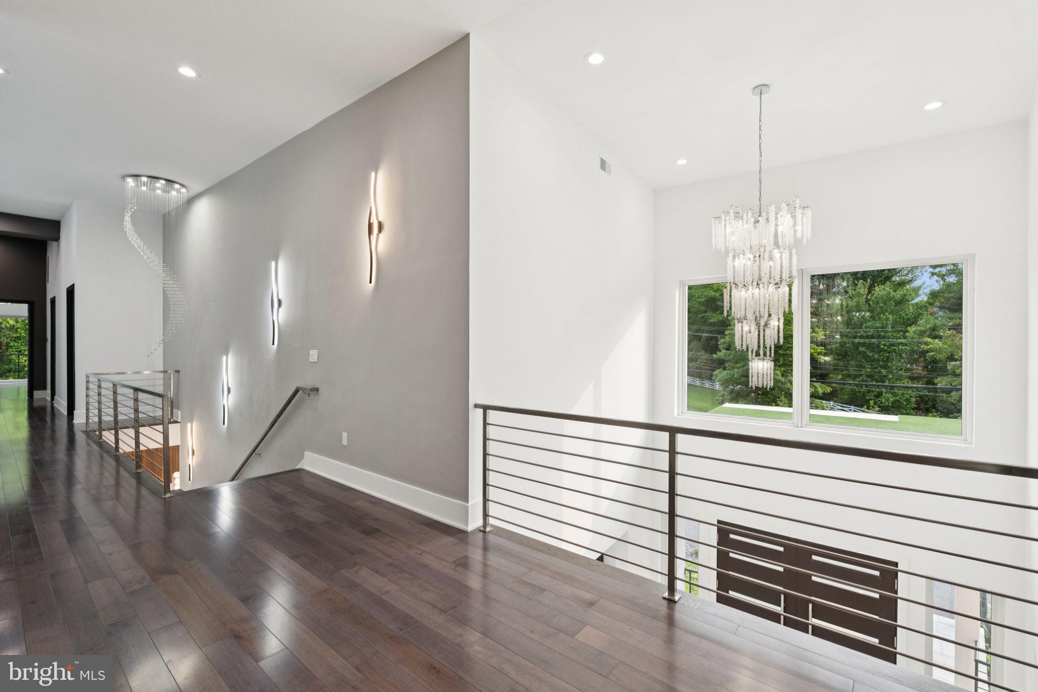 2209 Hunter Mill Road Vienna, VA 22181 - Photo 24 of 63 a view of a room with wooden floor and windows
