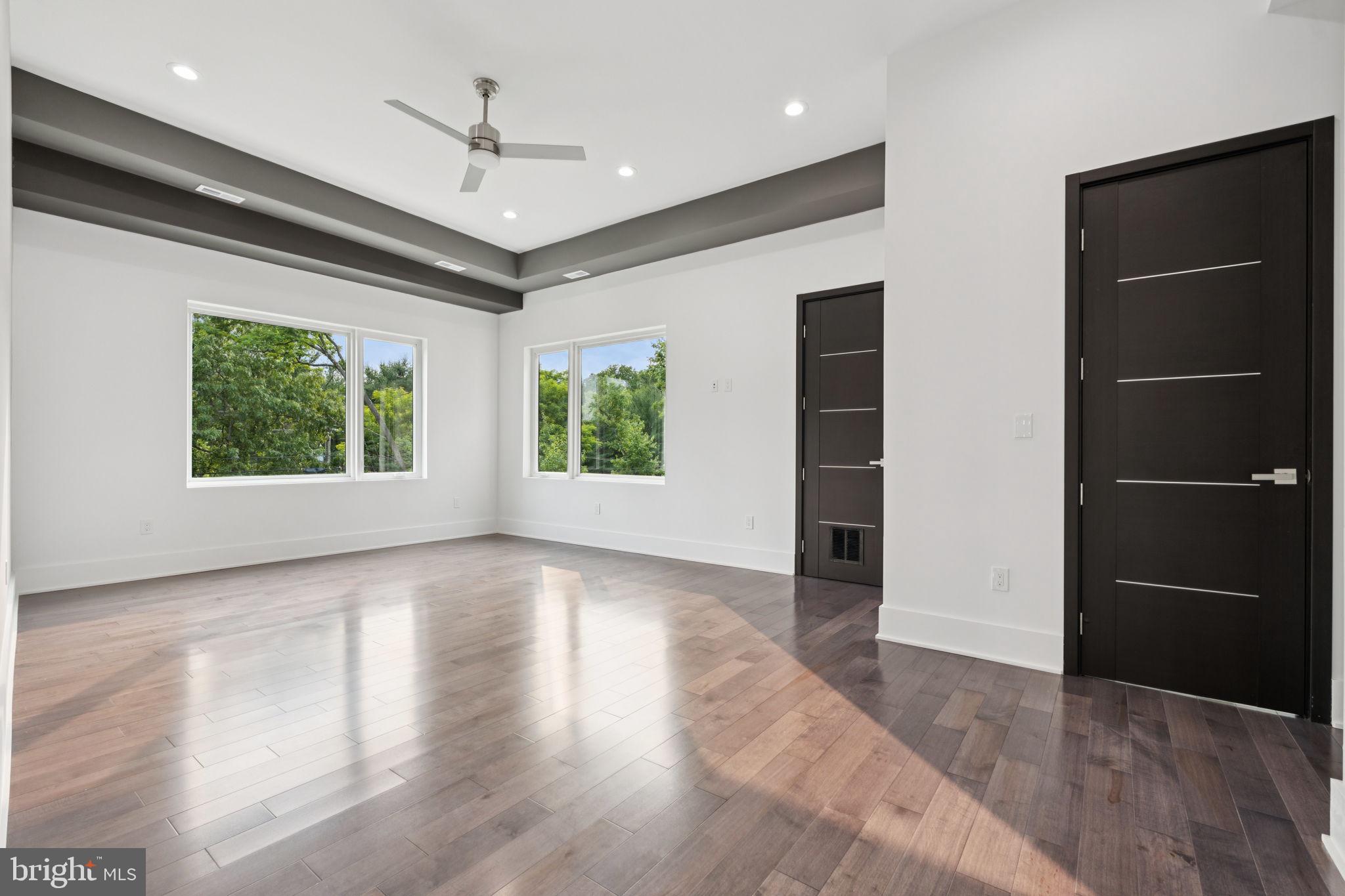 2209 Hunter Mill Road Vienna, VA 22181 - Photo 25 of 63 an empty room with windows closet and ceiling fan
