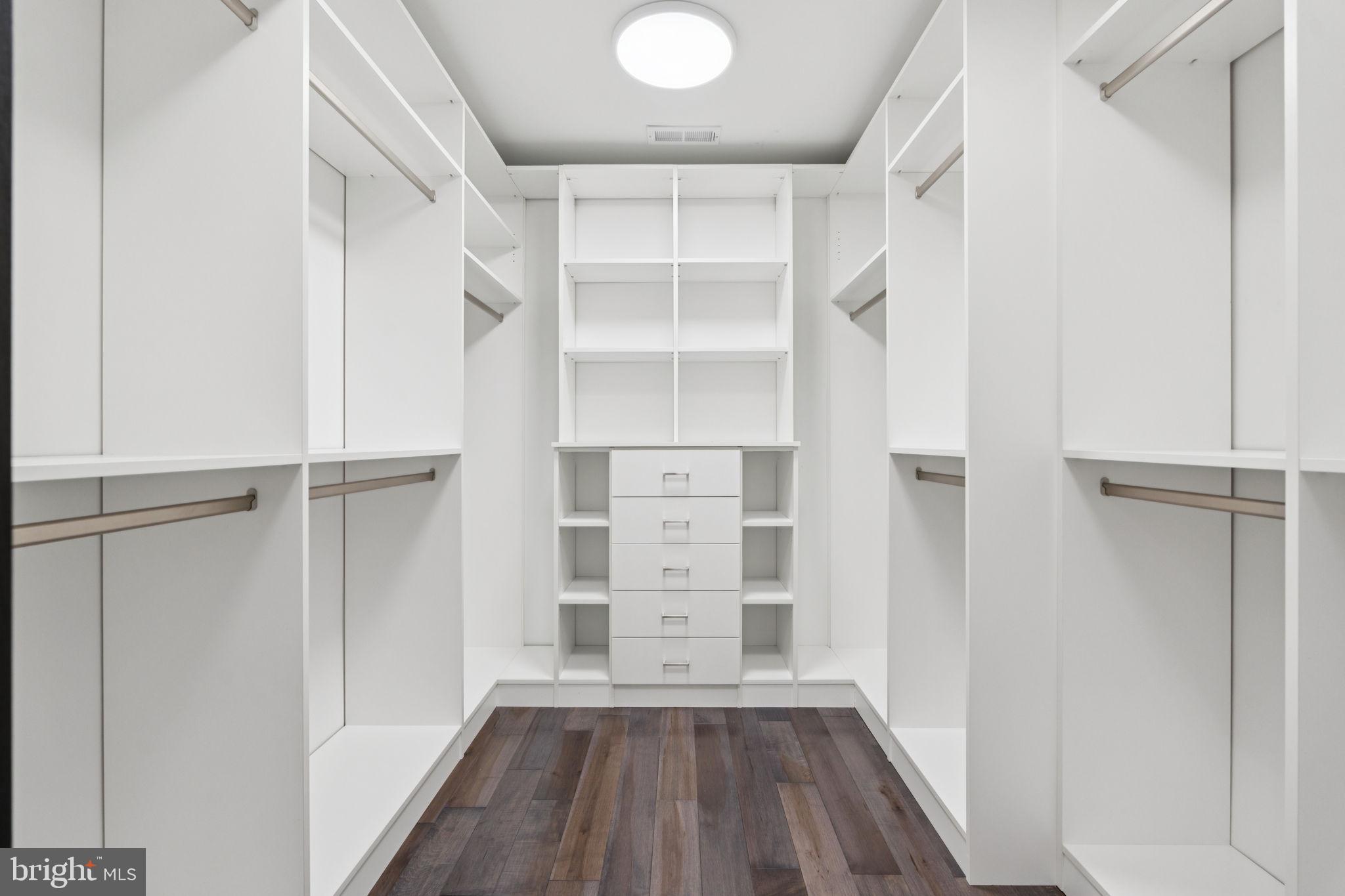 2209 Hunter Mill Road Vienna, VA 22181 - Photo 26 of 63 a view of walk in closet with empty racks