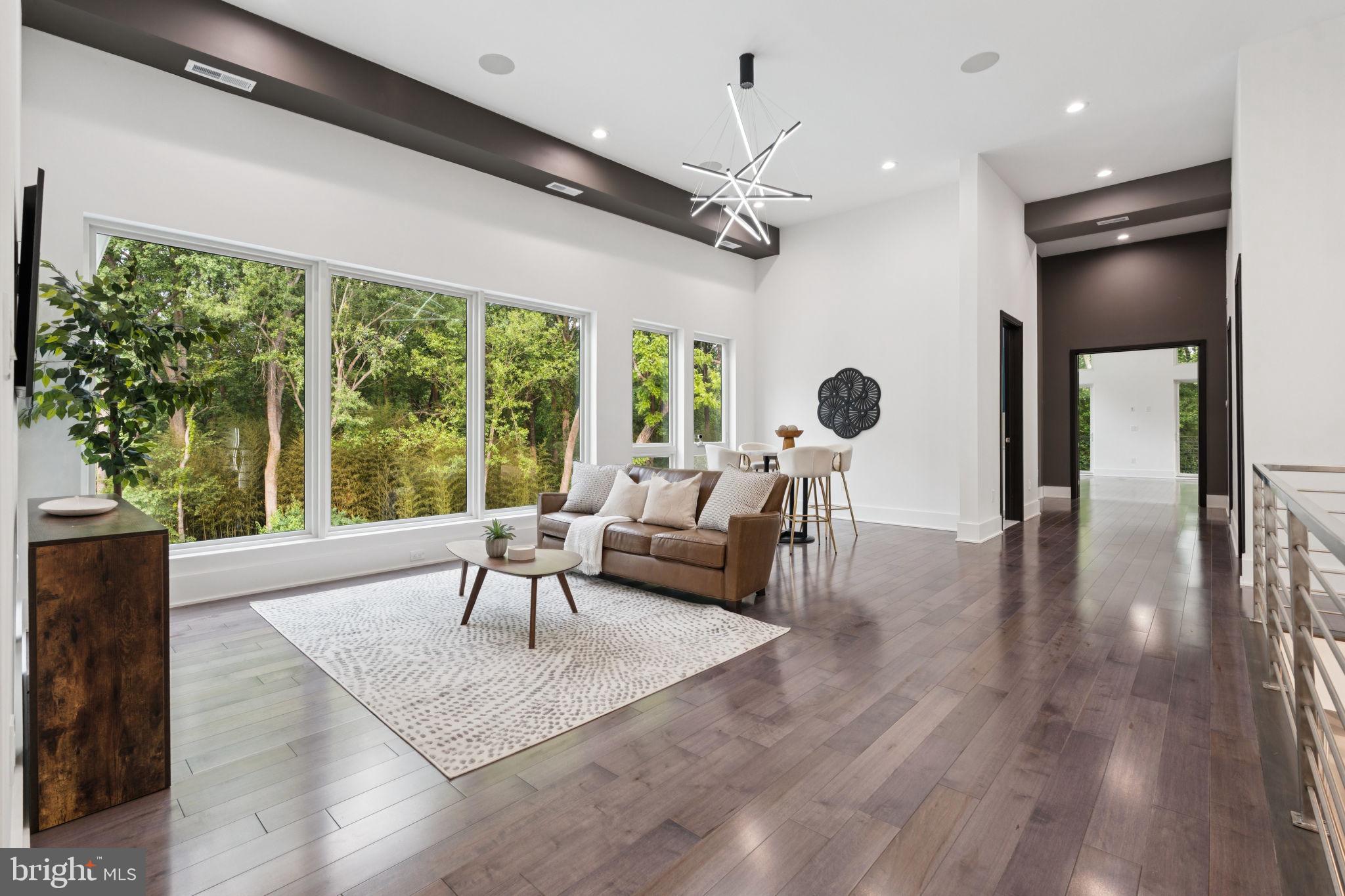 2209 Hunter Mill Road Vienna, VA 22181 - Photo 28 of 63 a living room with furniture and a large window