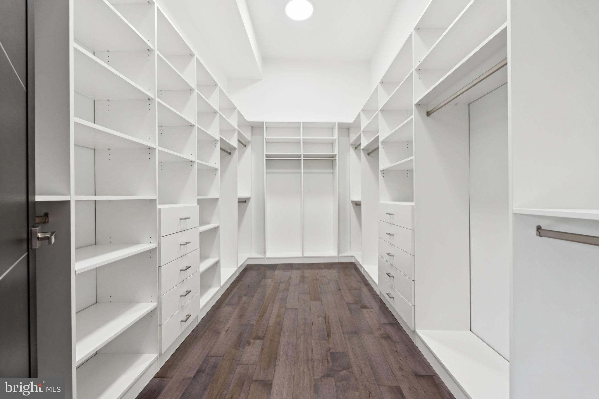 2209 Hunter Mill Road Vienna, VA 22181 - Photo 31 of 63 a view of walk in closet with empty racks