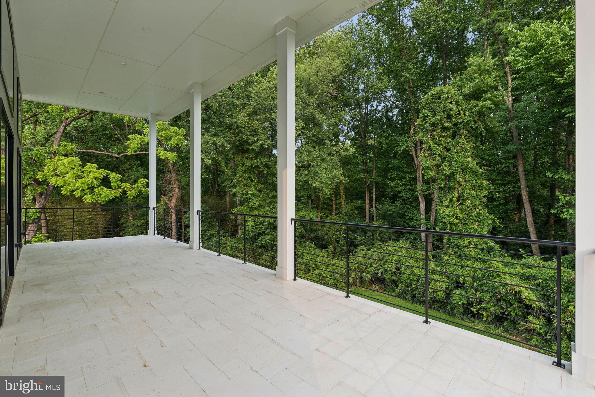 2209 Hunter Mill Road Vienna, VA 22181 - Photo 40 of 63 a view of a backyard with plants and large trees