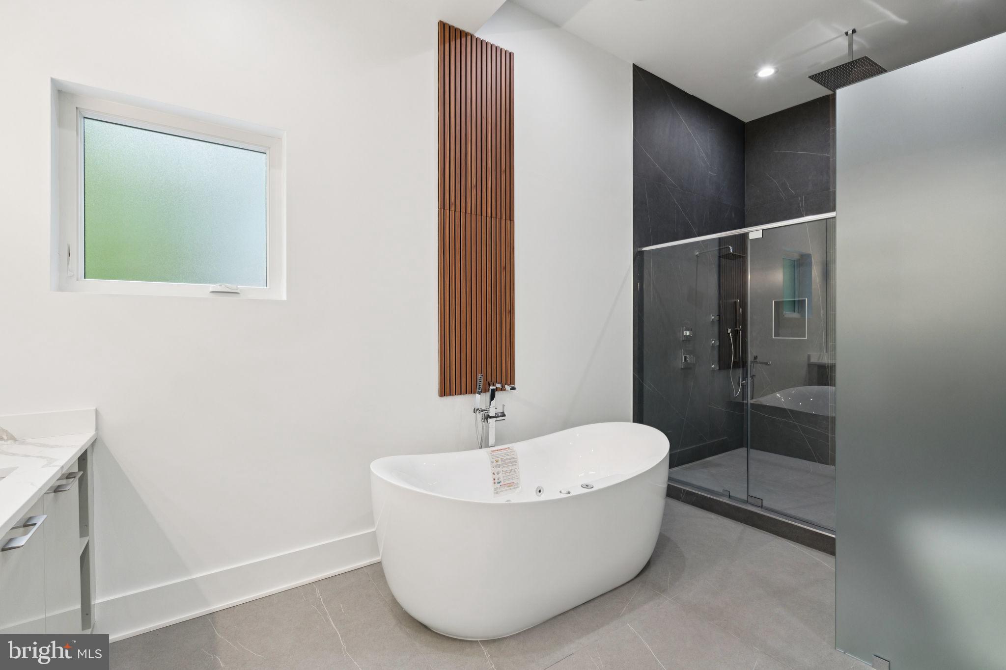 2209 Hunter Mill Road Vienna, VA 22181 - Photo 45 of 63 a bathroom with a bathtub and shower