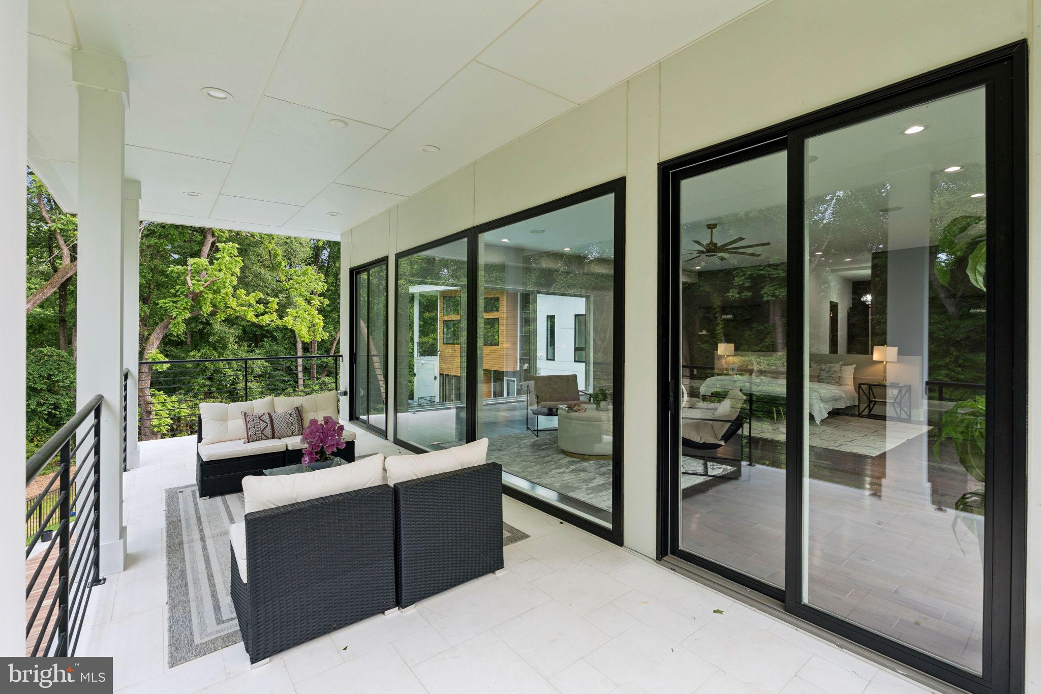 2209 Hunter Mill Road Vienna, VA 22181 - Photo 47 of 63 a living room with furniture and a floor to ceiling window