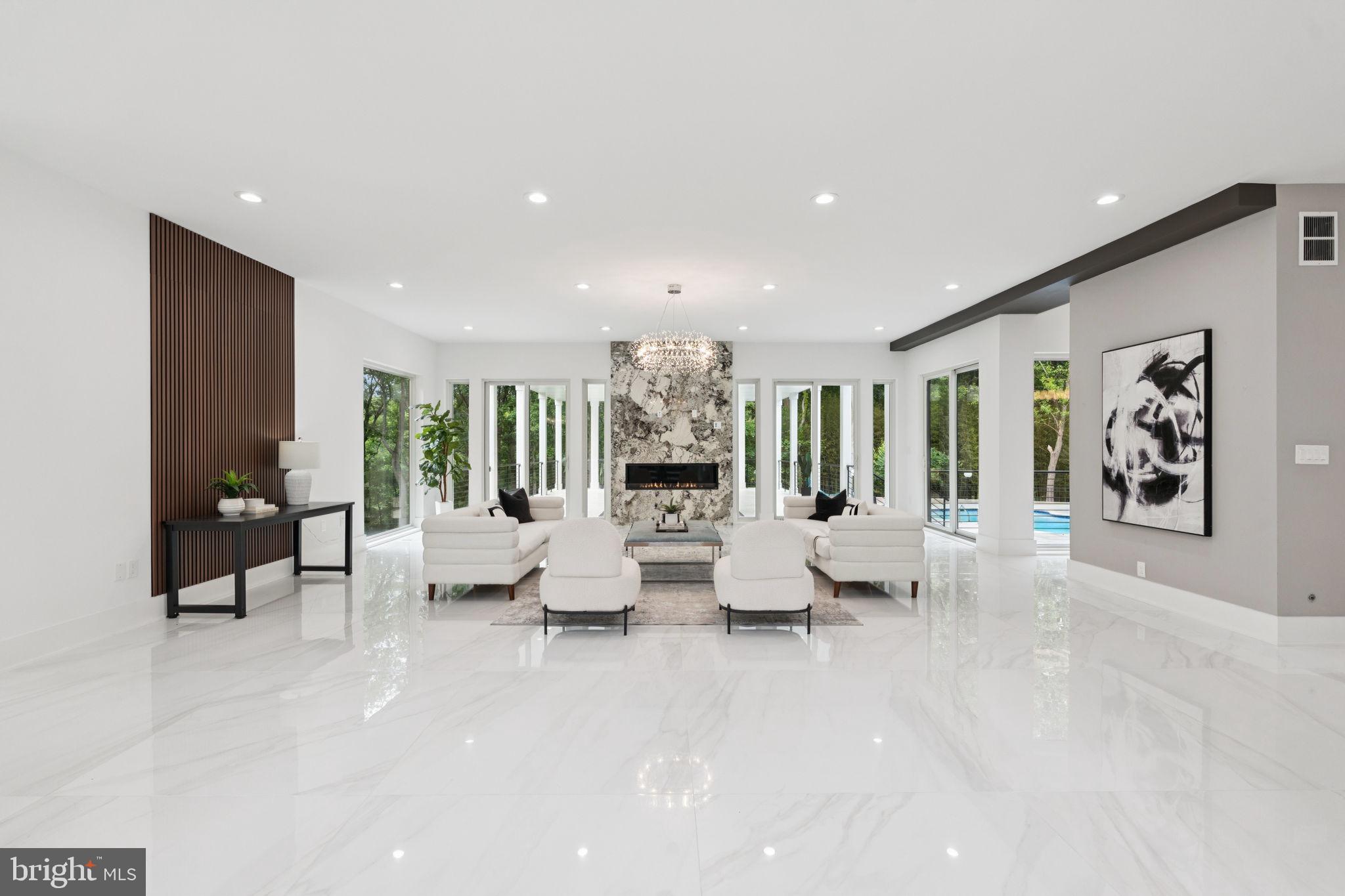 2209 Hunter Mill Road Vienna, VA 22181 - Photo 5 of 63 a living room with fireplace furniture and a large window
