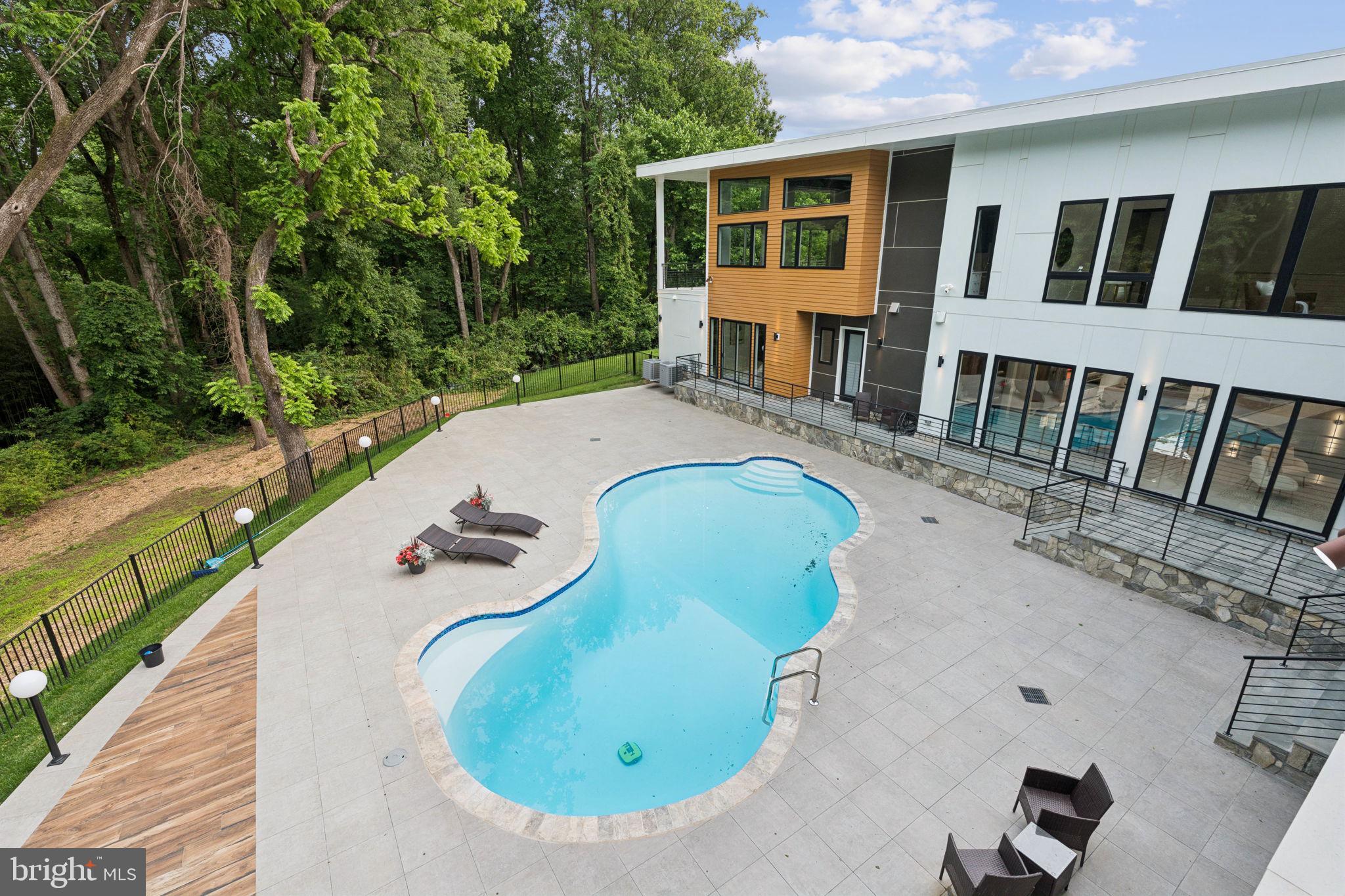 2209 Hunter Mill Road Vienna, VA 22181 - Photo 56 of 63 a view of a house with backyard and sitting area