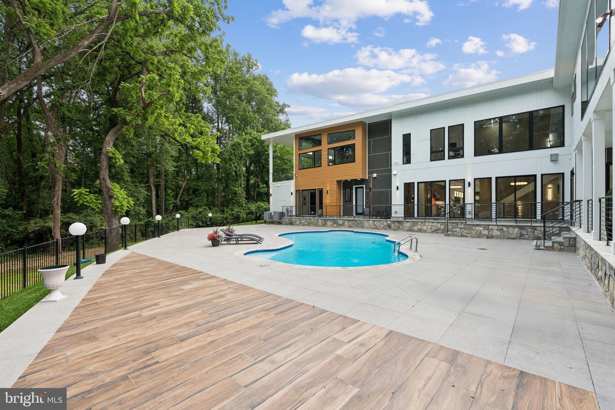 2209 Hunter Mill Road Vienna, VA 22181 - Photo 59 of 63 a view of pool with brick walls
