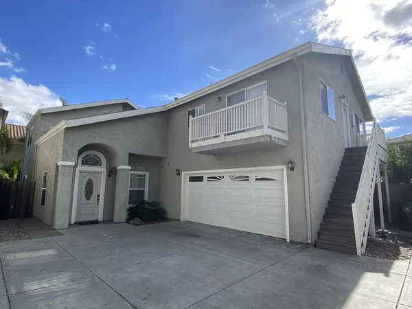 a front view of a house with parking
