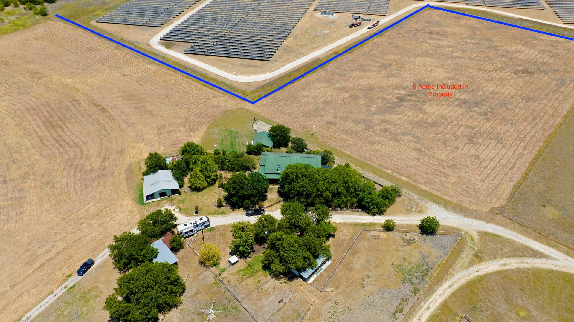 13212 Sandeen Road Coupland, TX 78615 - Photo 13 of 17 a backyard of a house with a yard and outdoor seating