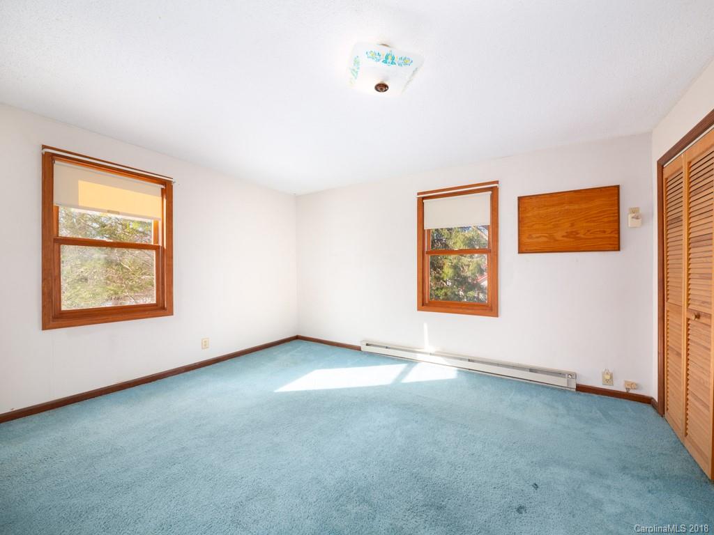 551 Bee Tree Road Swannanoa, NC 28778 - Photo 19 of 29 an empty room with windows