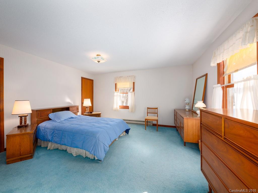 551 Bee Tree Road Swannanoa, NC 28778 - Photo 20 of 29 a bedroom with a bed and a window