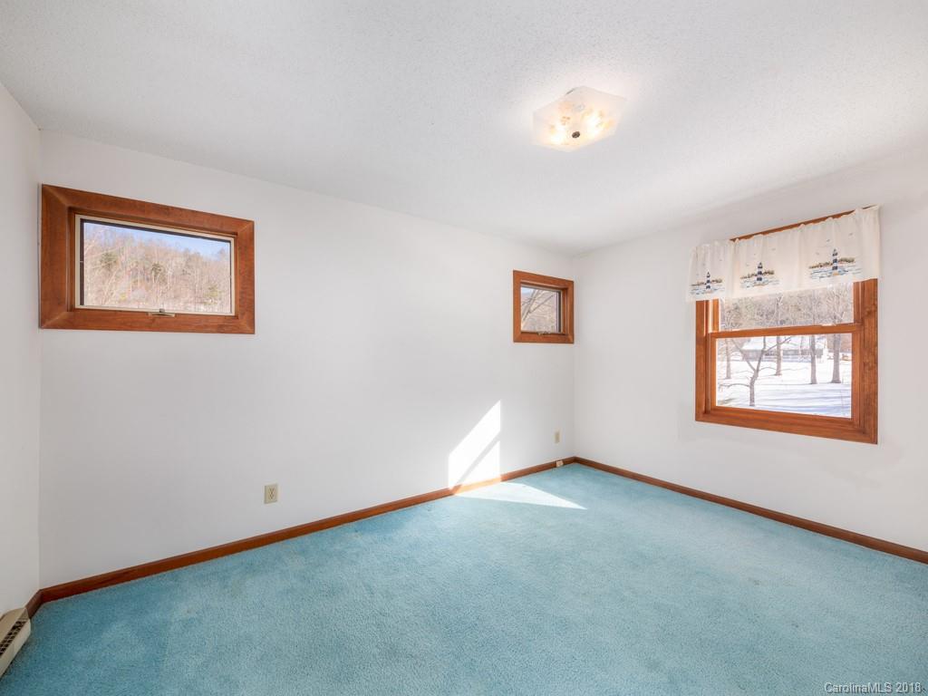 551 Bee Tree Road Swannanoa, NC 28778 - Photo 21 of 29 a view of an empty room with window