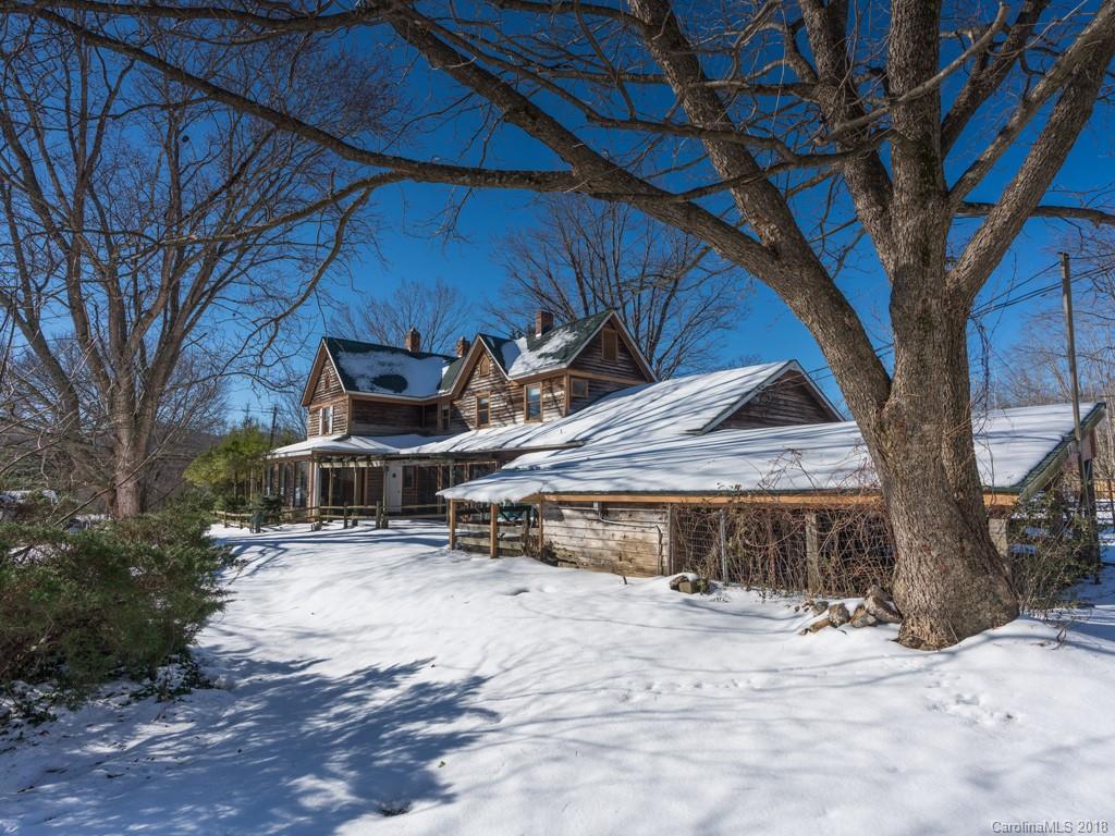 551 Bee Tree Road Swannanoa, NC 28778 - Photo 5 of 29 a view of a house with a yard covered with snow