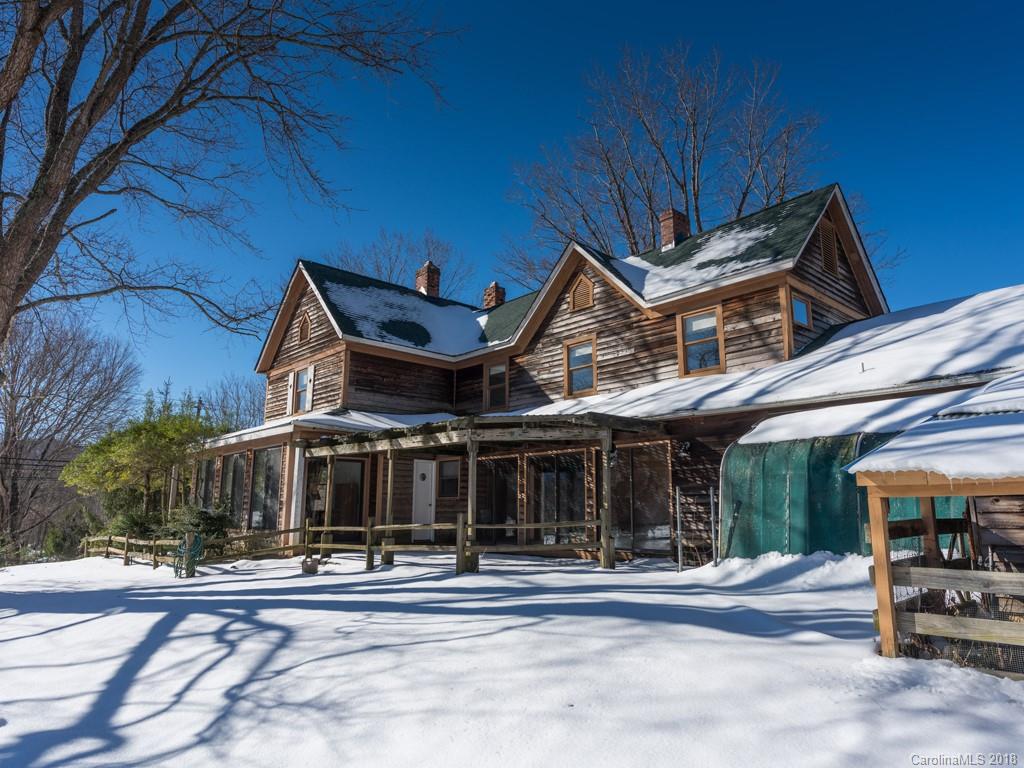 551 Bee Tree Road Swannanoa, NC 28778 - Photo 7 of 29 a front view of a house with a garden and plants