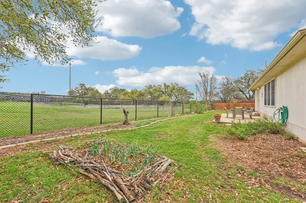a view of a golf course with a big yard