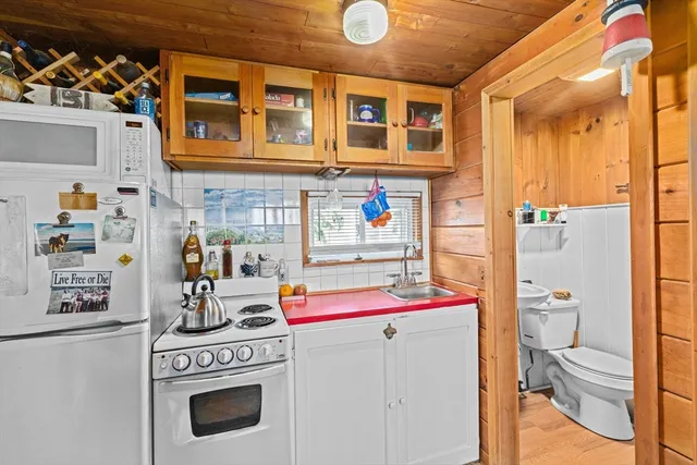 a view of walk in closet with clothes