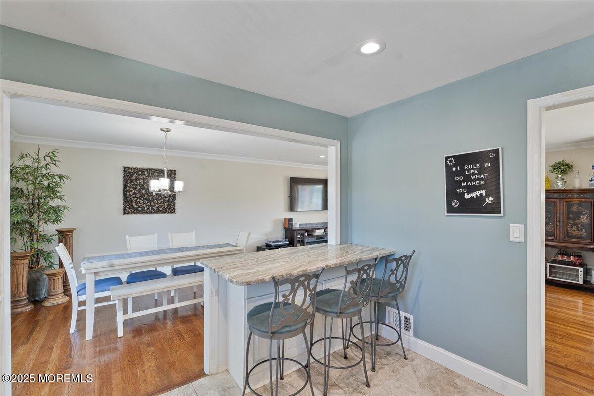 165 Port Road Brick, NJ 08723 - Photo 14 of 48 a view of a dining room with furniture and a potted plant