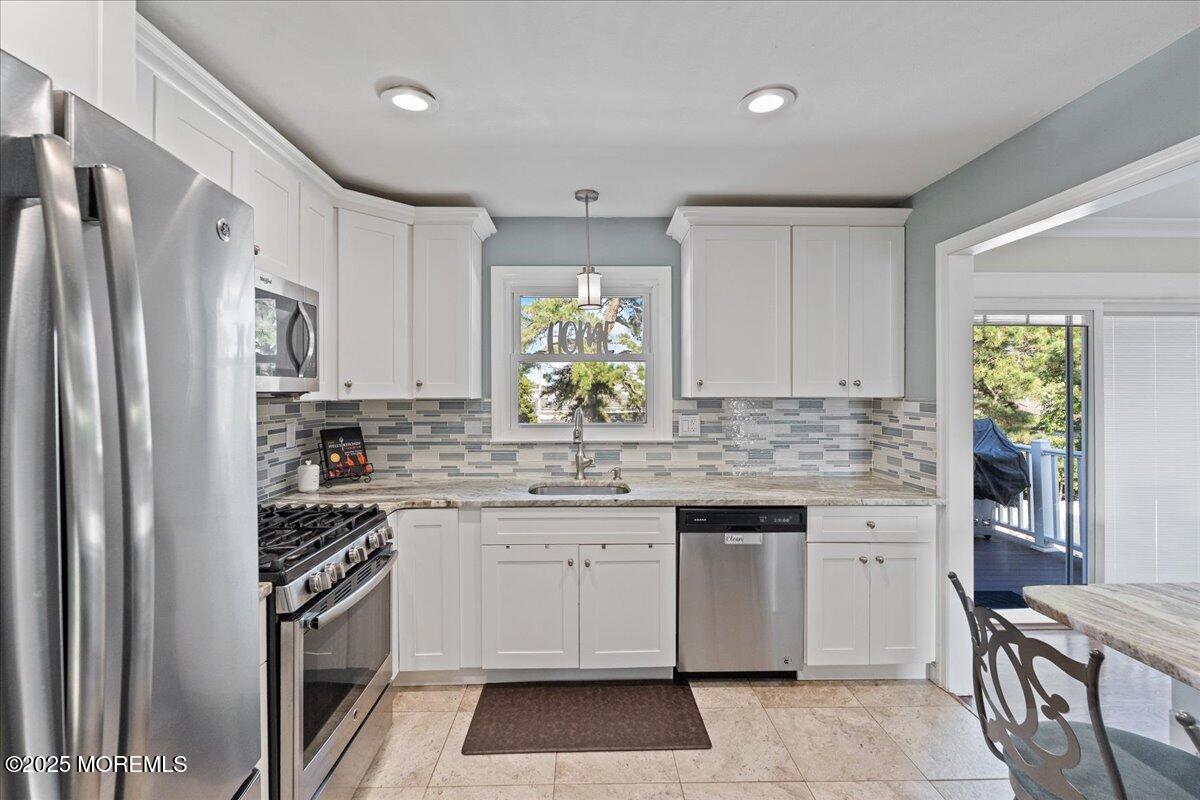 165 Port Road Brick, NJ 08723 - Photo 15 of 48 a kitchen with a sink stove and refrigerator