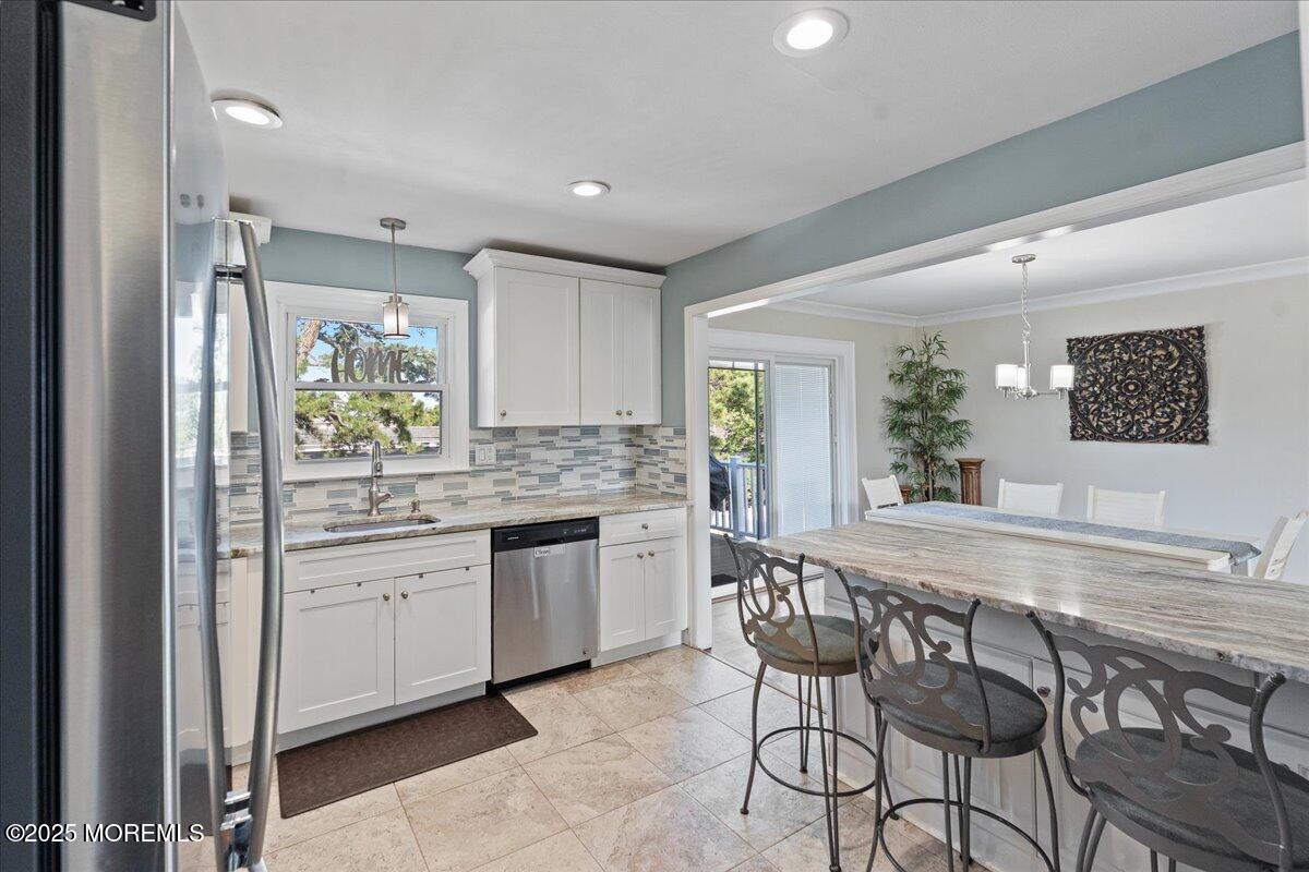 165 Port Road Brick, NJ 08723 - Photo 16 of 48 a kitchen with a sink cabinets and window