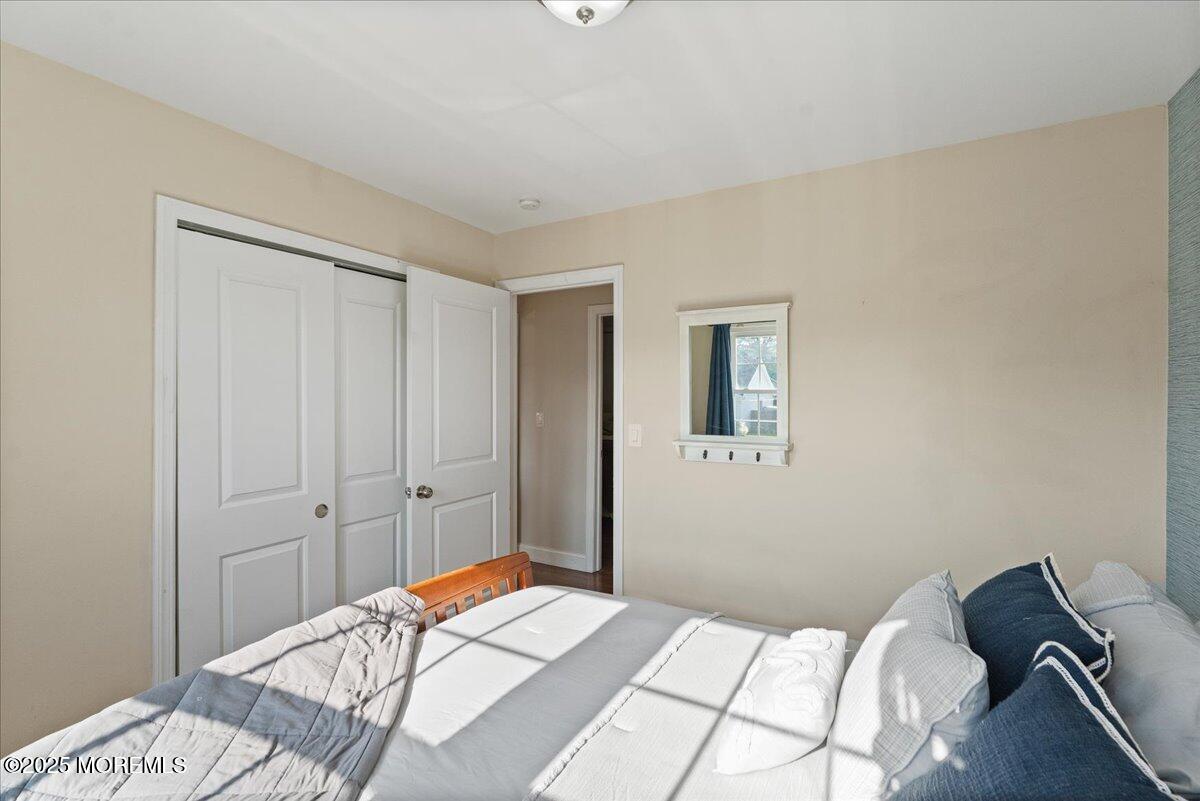 165 Port Road Brick, NJ 08723 - Photo 18 of 48 a bedroom with a bed and a lamp