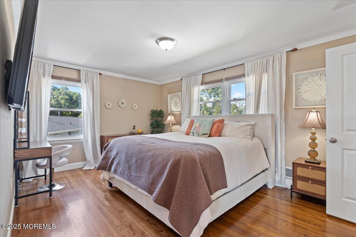 165 Port Road Brick, NJ 08723 - Photo 21 of 48 a bedroom with a bed and wooden floor