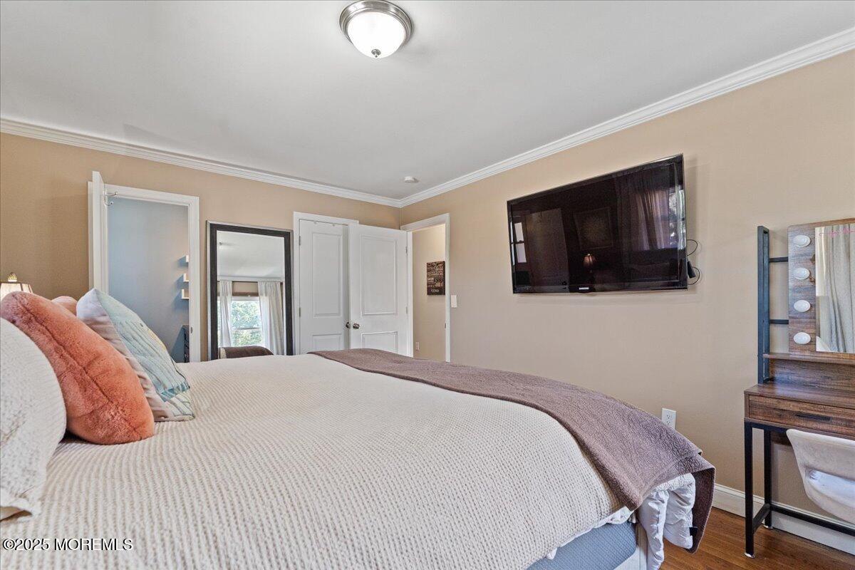 165 Port Road Brick, NJ 08723 - Photo 23 of 48 a bedroom with a bed and a flat screen tv