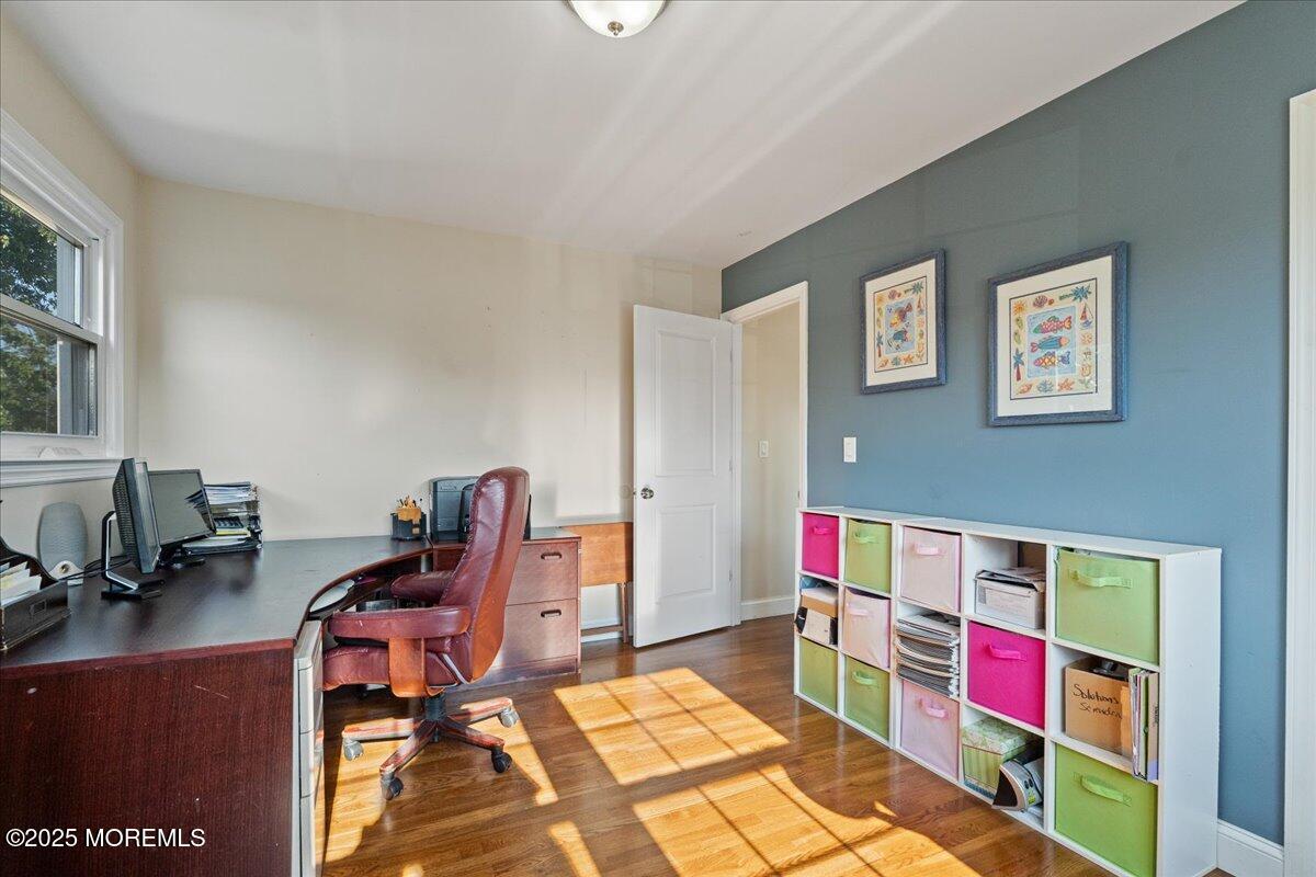 165 Port Road Brick, NJ 08723 - Photo 26 of 48 a living room with a couch and a dining table