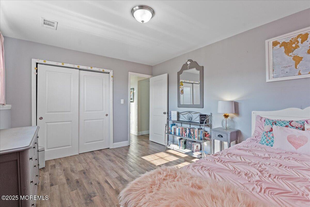 165 Port Road Brick, NJ 08723 - Photo 28 of 48 a bedroom with a bed dresser and a window