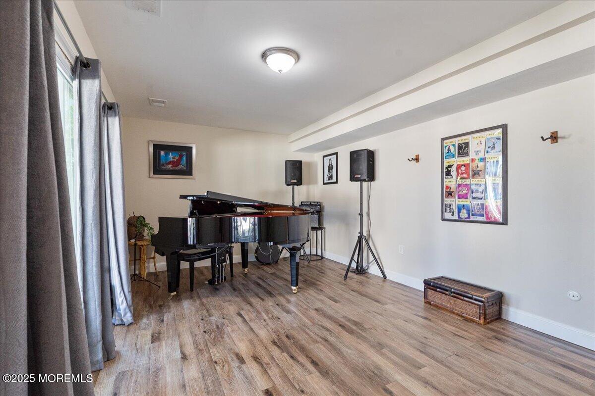 165 Port Road Brick, NJ 08723 - Photo 30 of 48 a living room with furniture and a wooden floor