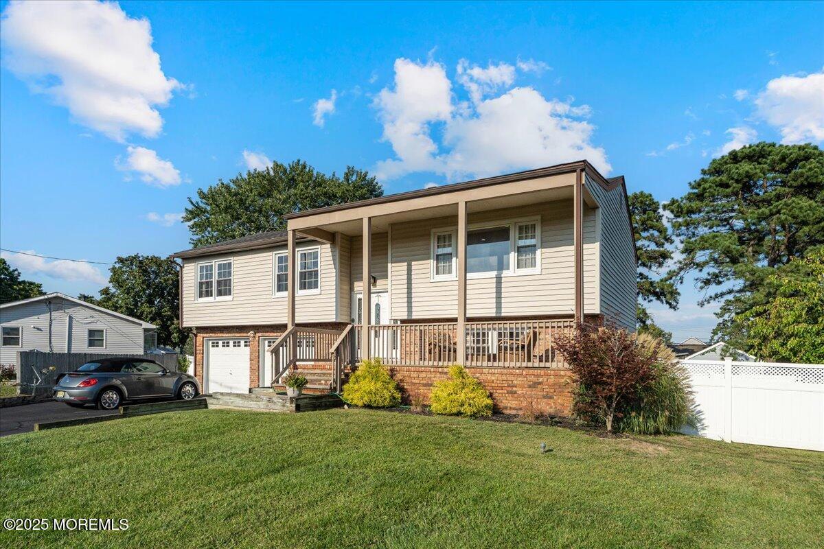 165 Port Road Brick, NJ 08723 - Photo 3 of 48 a front view of a house with a garden