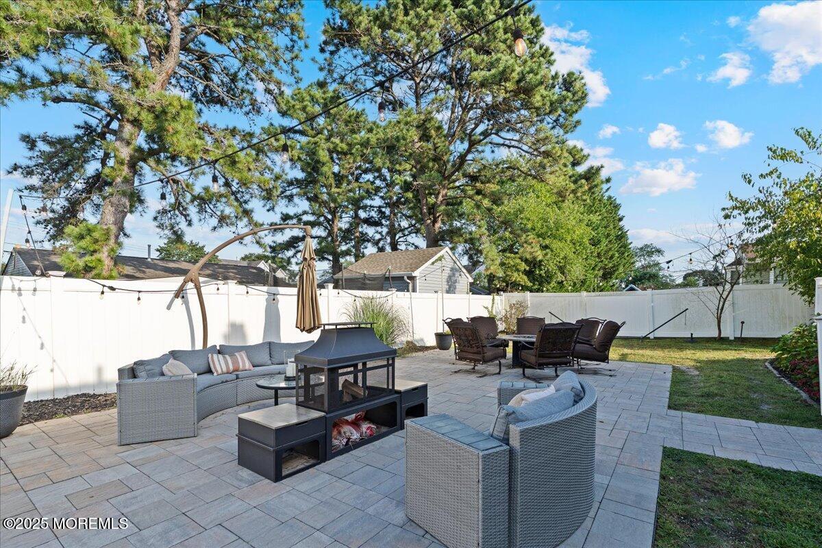 165 Port Road Brick, NJ 08723 - Photo 36 of 48 a view of patio with couches and a fire pit