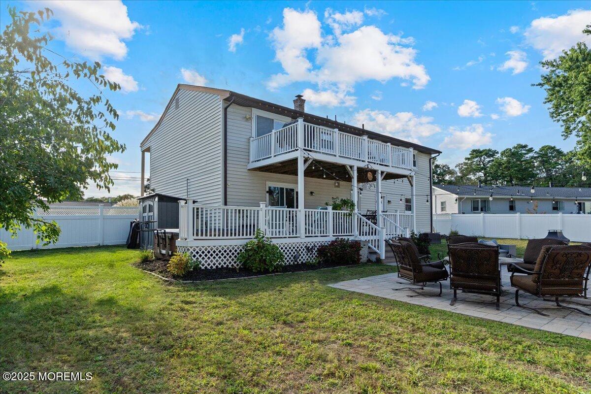 165 Port Road Brick, NJ 08723 - Photo 41 of 48 a view of a chair and table in backyard of the house
